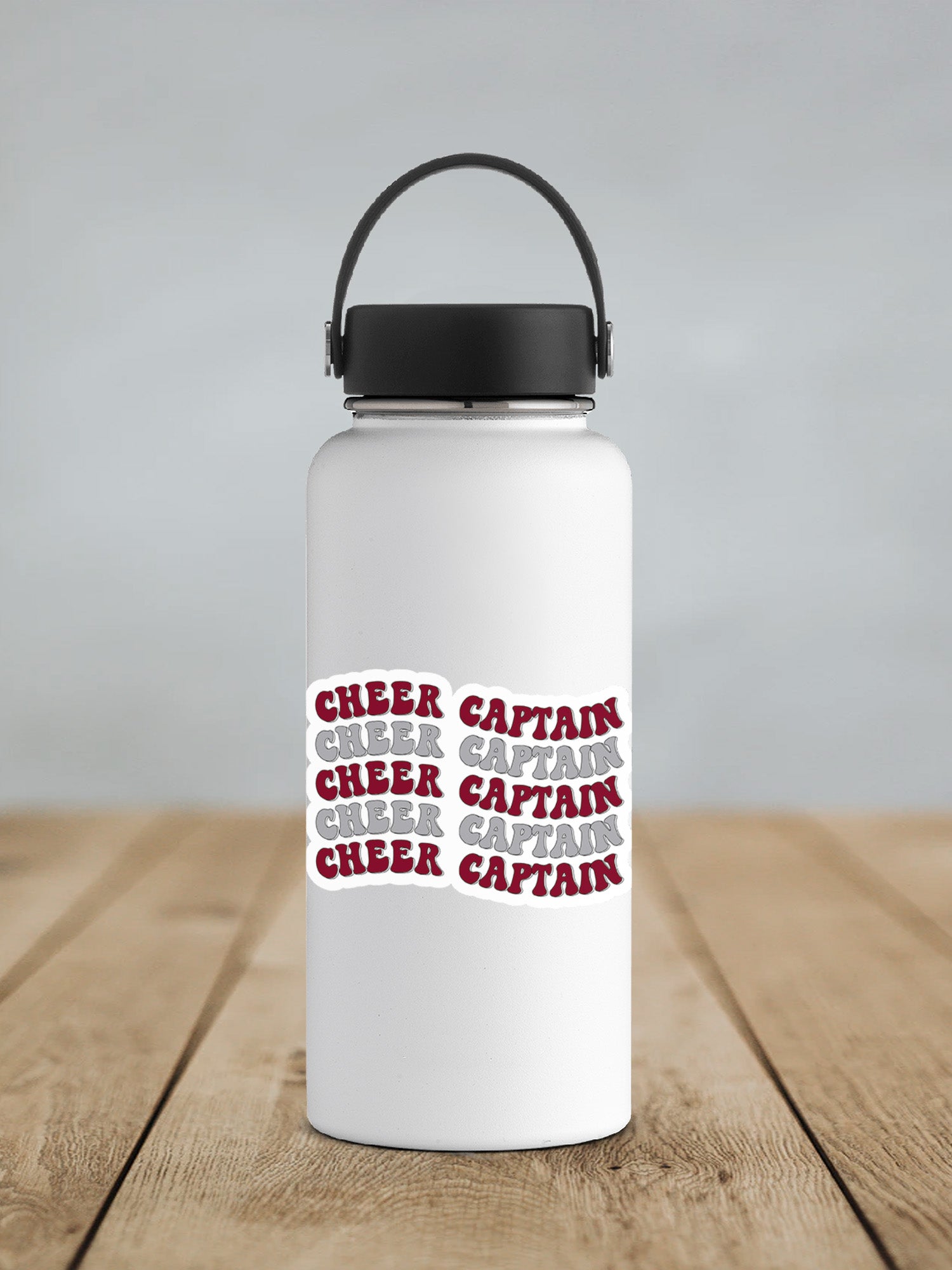 a white water bottle sitting on top of a wooden table