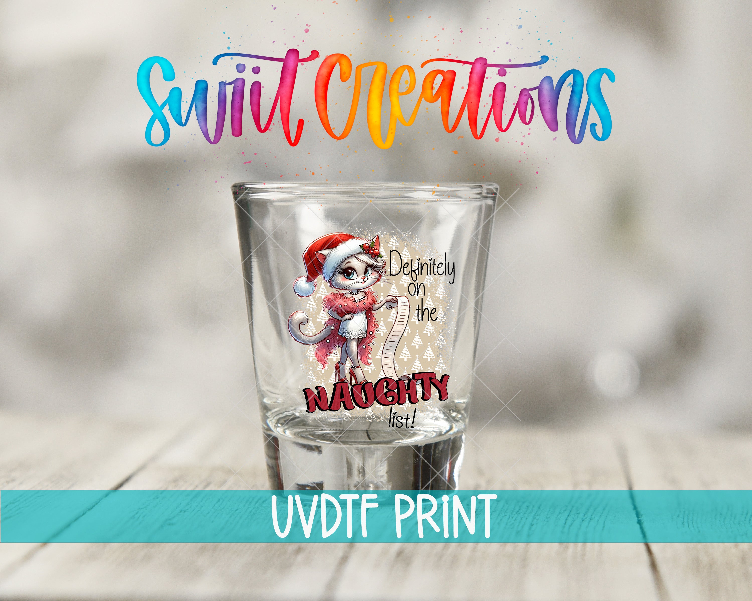 A shot glass with a cartoon character on it, placed on a wooden surface.