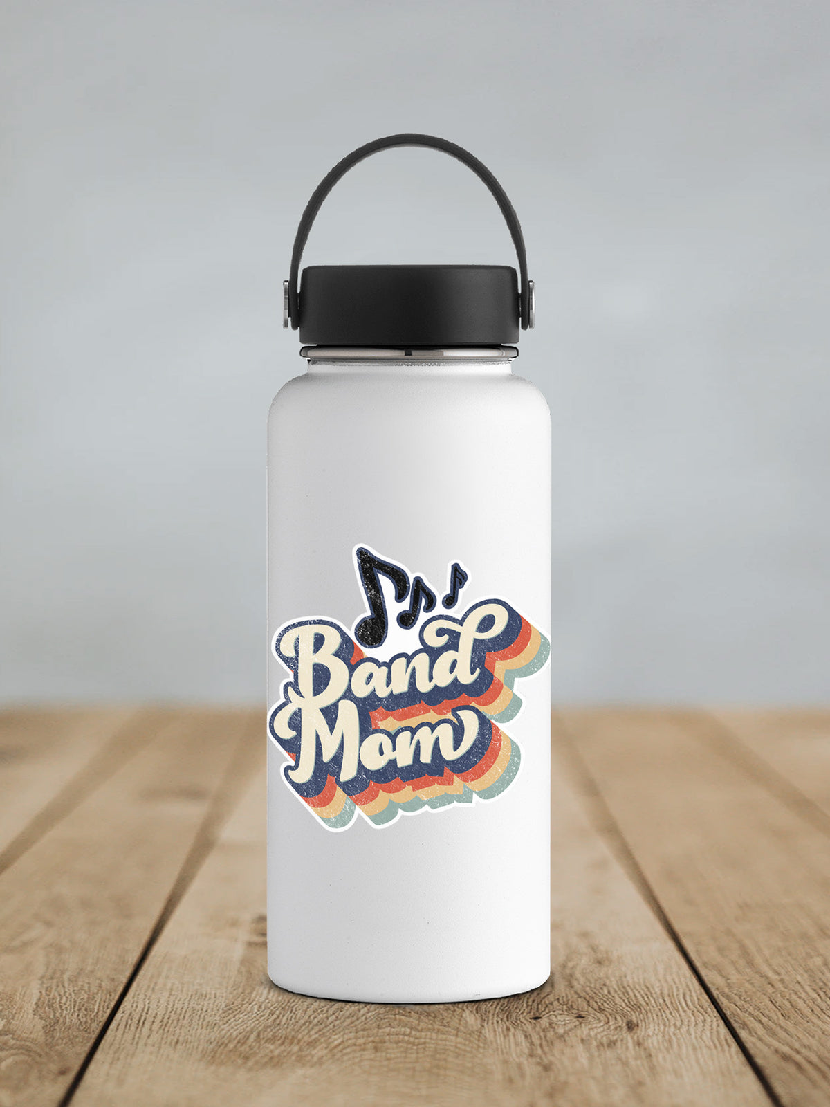 a white water bottle sitting on top of a wooden table