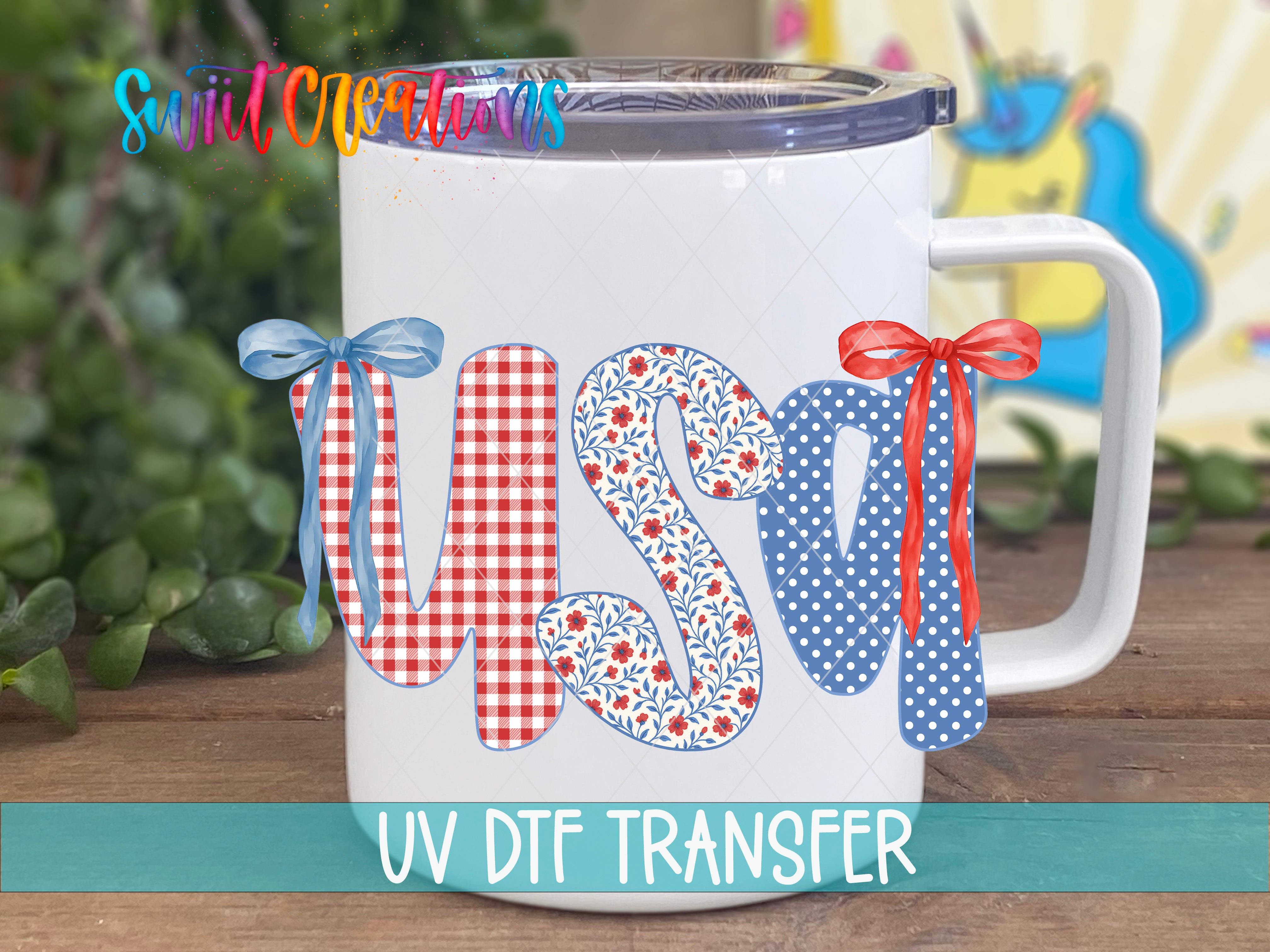A white mug with the word "USA" printed on it, along with decorative ribbons and floral patterns.