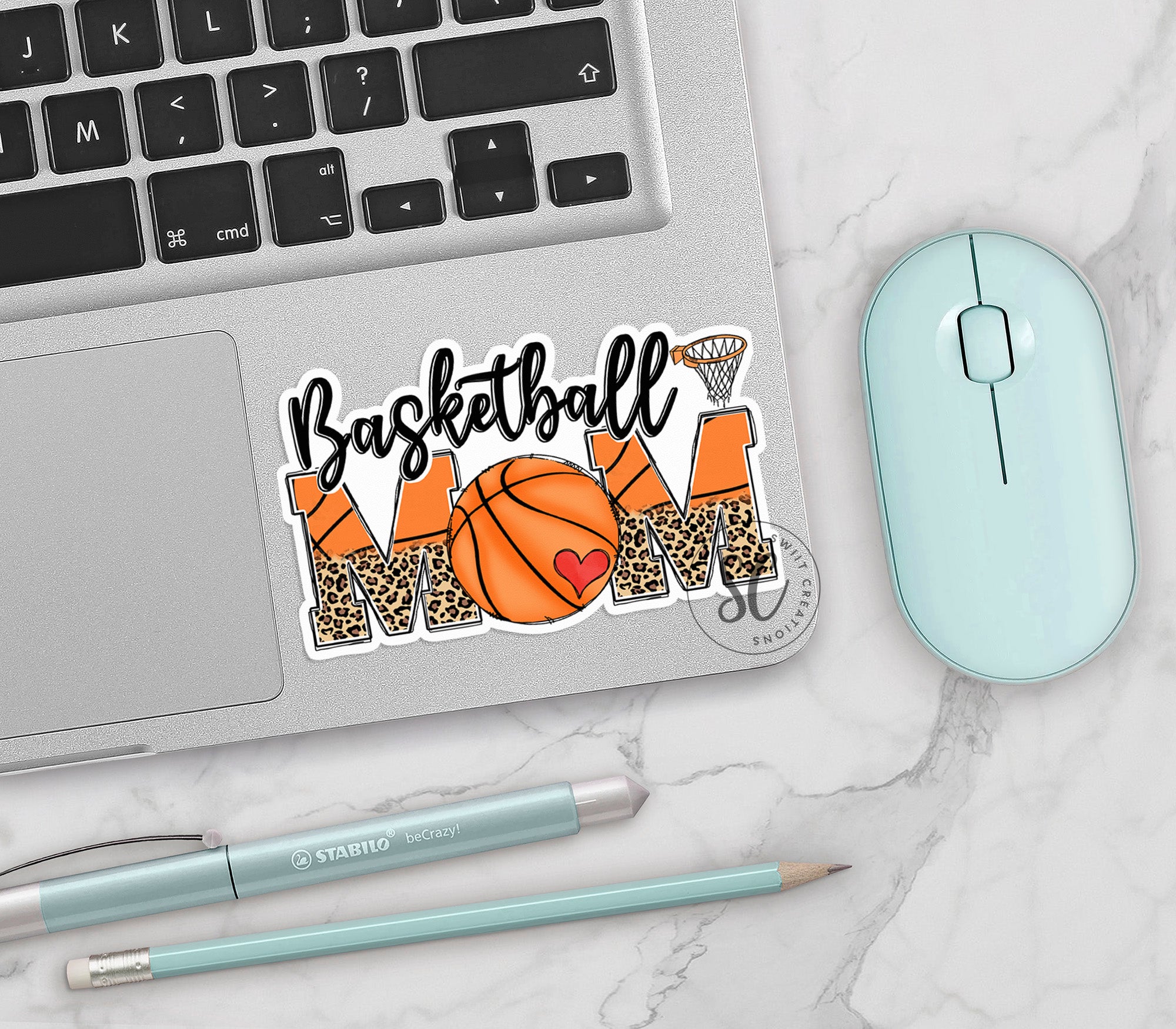 a laptop with a basketball mom sticker on it