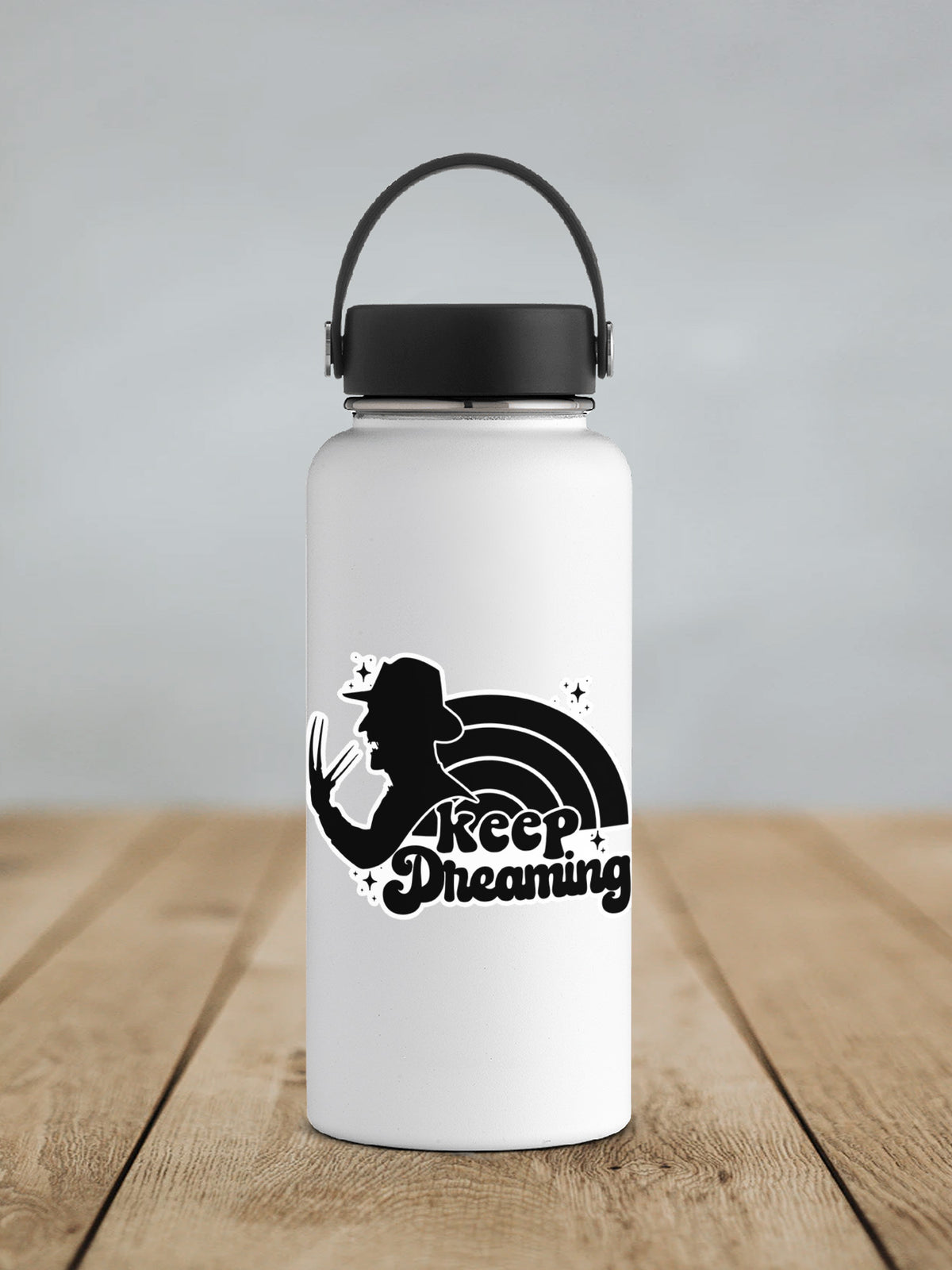 a white water bottle sitting on top of a wooden table