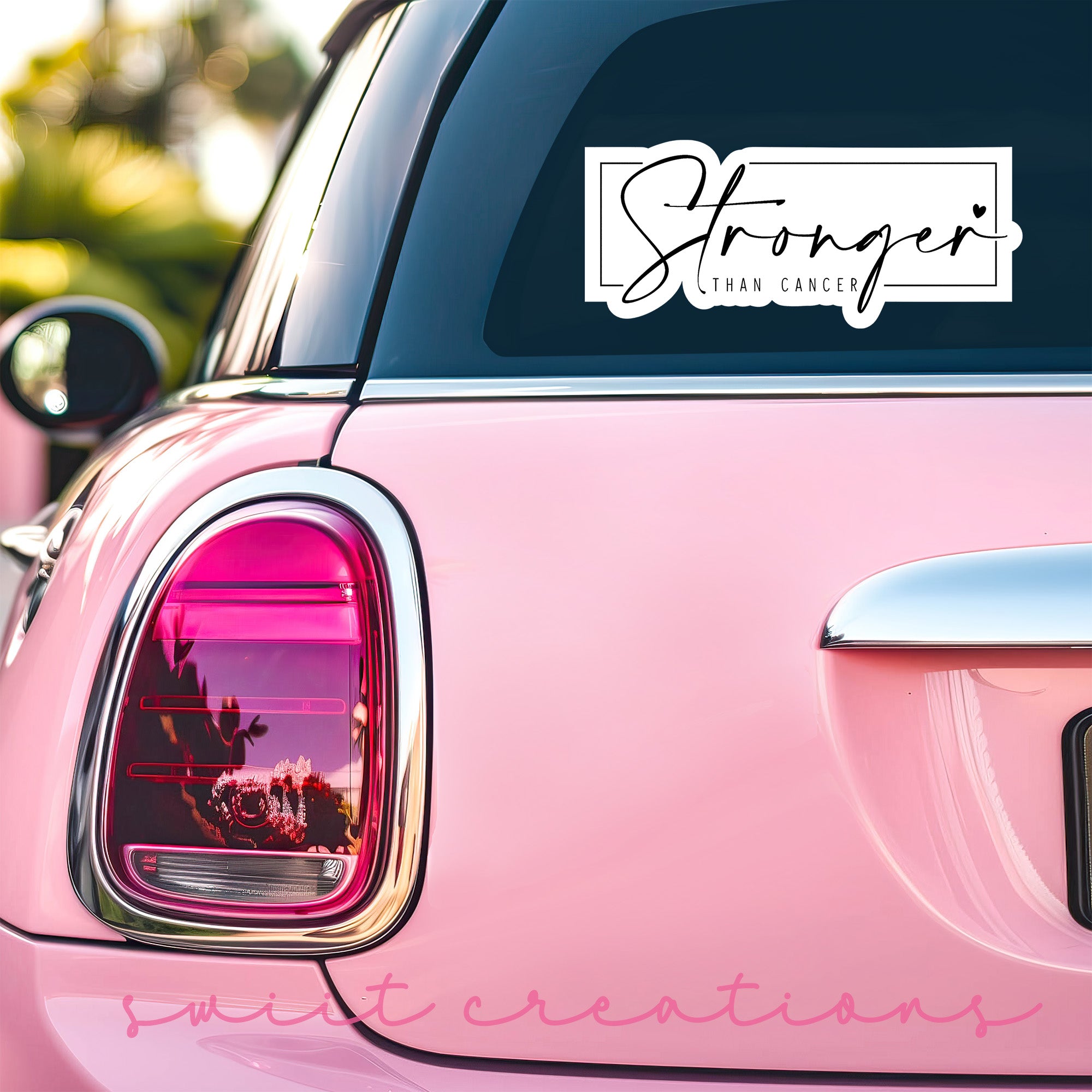 a pink car that has a sticker on it