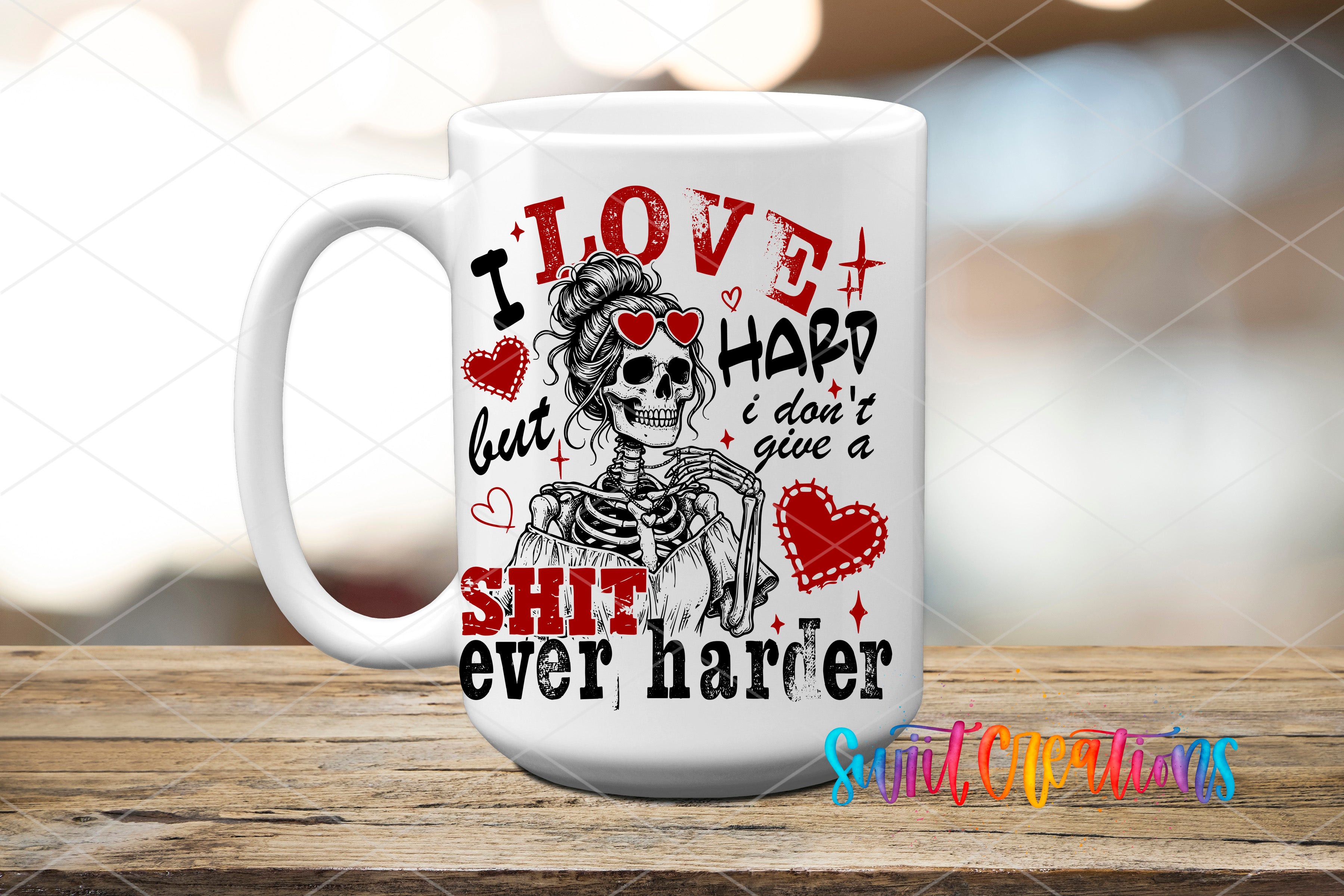 A white ceramic mug with a black and red design featuring a skeleton wearing sunglasses and the text "I LOVE HARD but I DON'T give a SHIT ever harder".