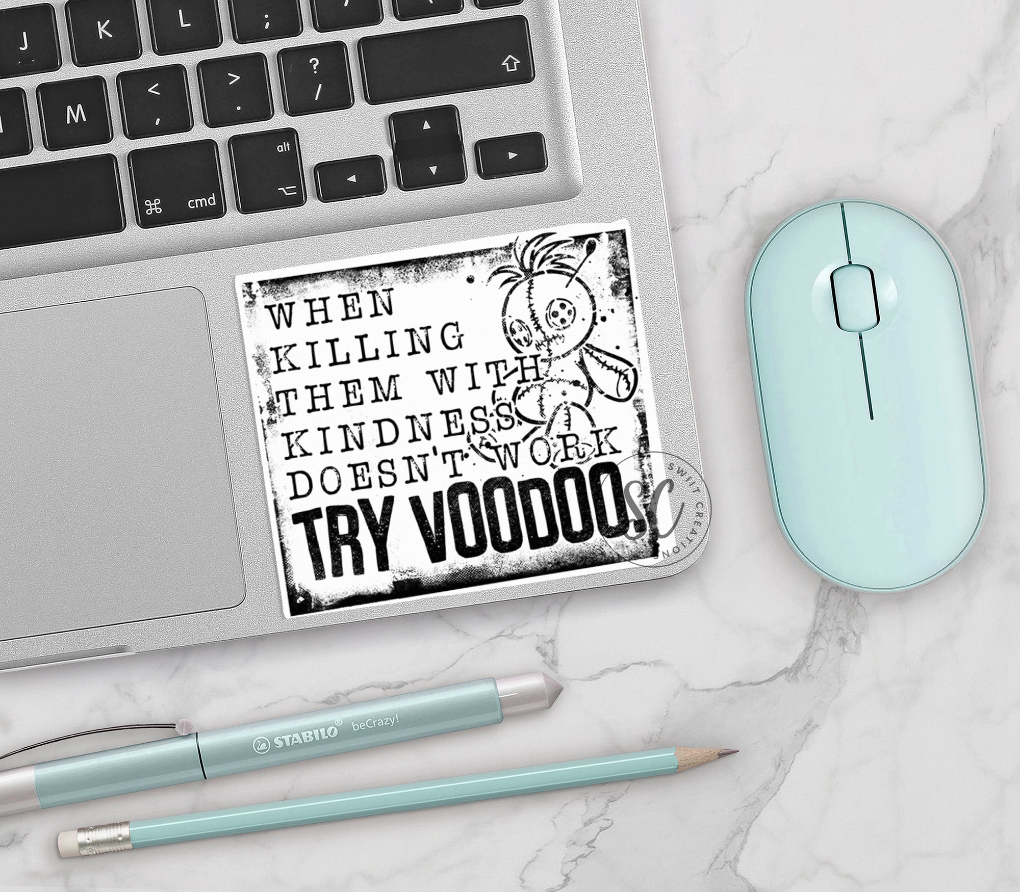 a laptop computer sitting on top of a white table