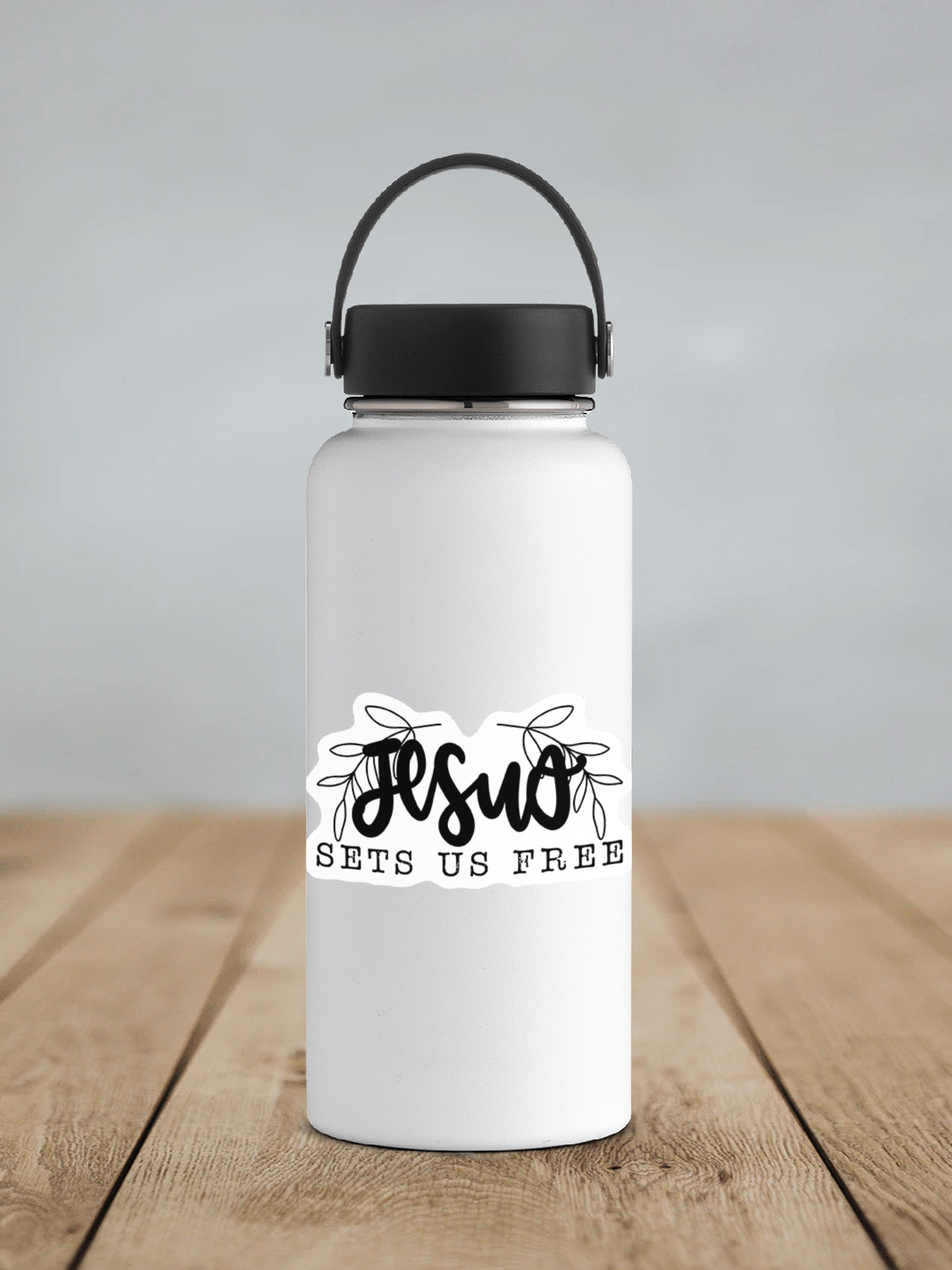 a white water bottle sitting on top of a wooden table