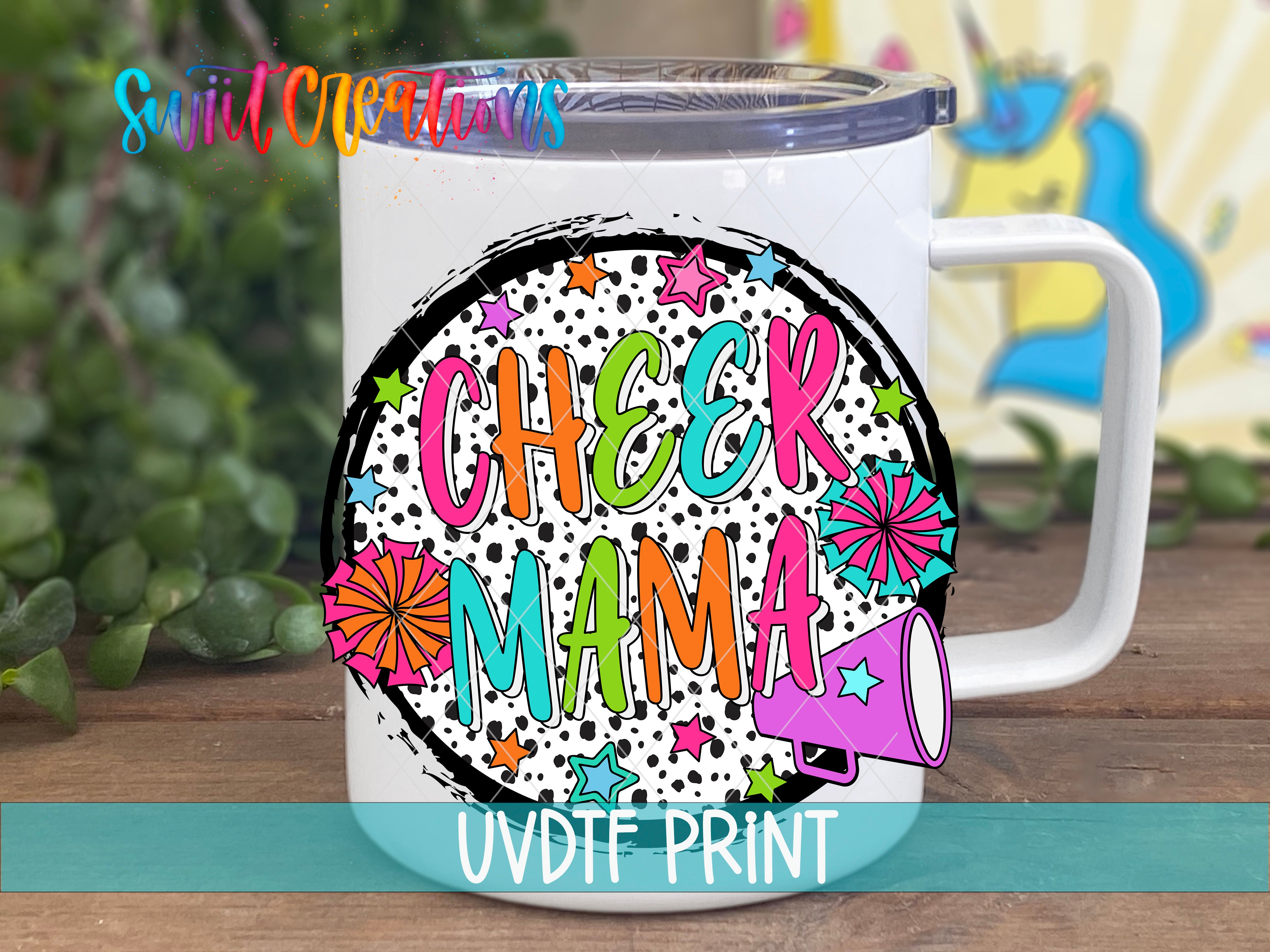 A white mug with a colorful design featuring the text "CHEER MAMA" surrounded by various decorative elements such as stars, flowers, and a megaphone.