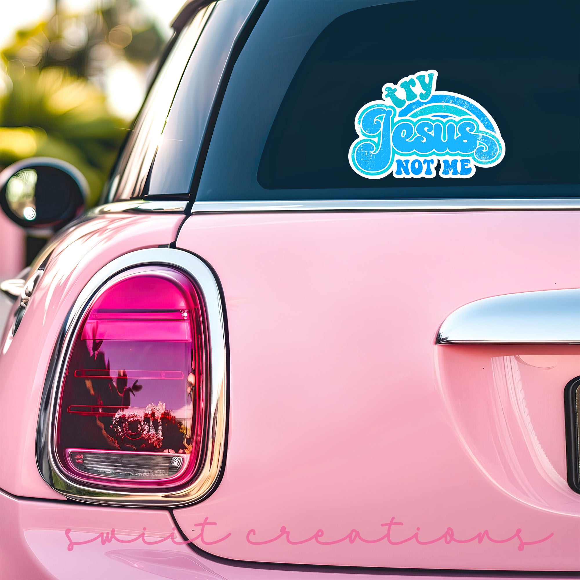 a pink car with a sticker on it