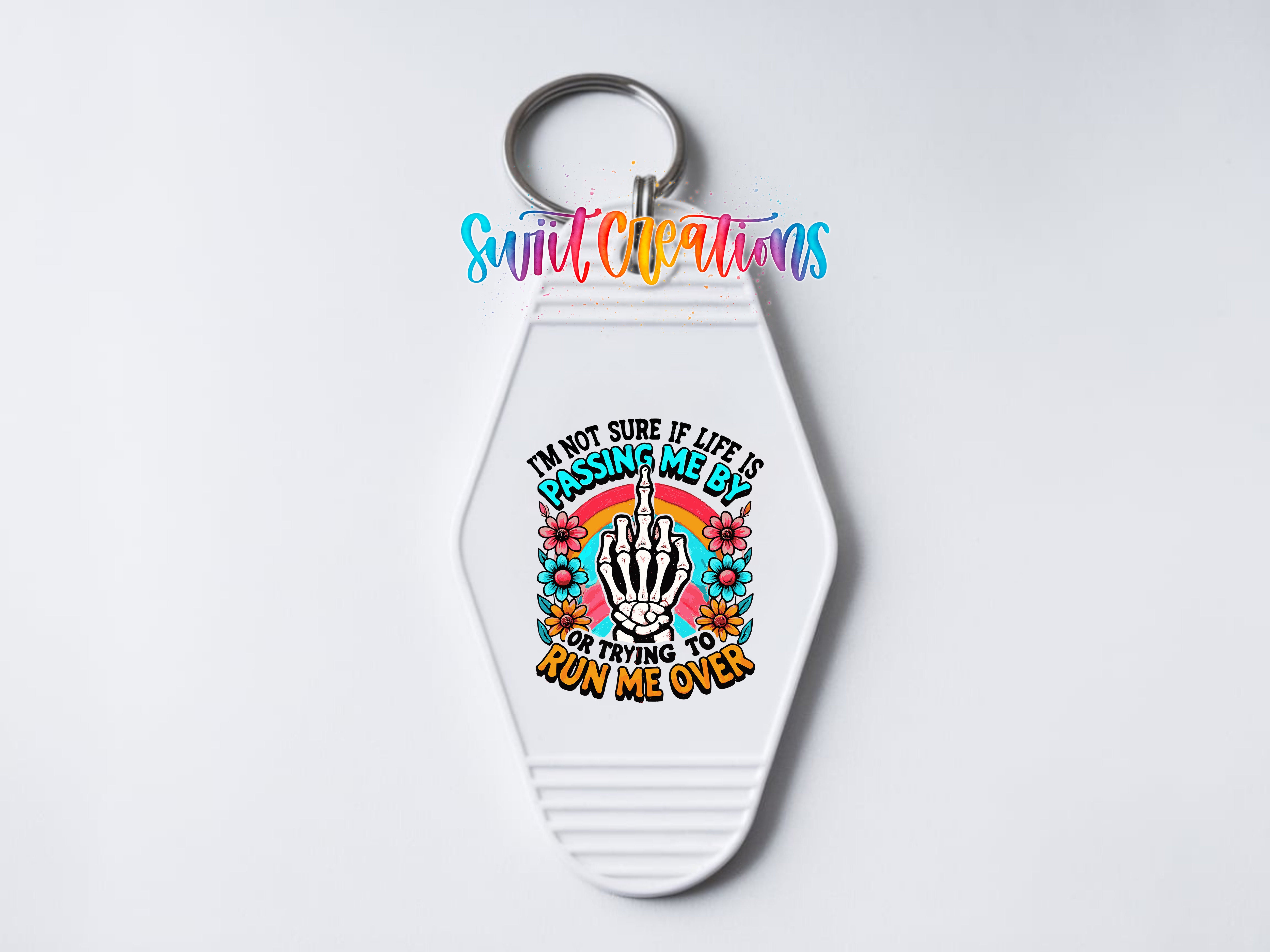 A keychain with a colorful graphic design and text on it.