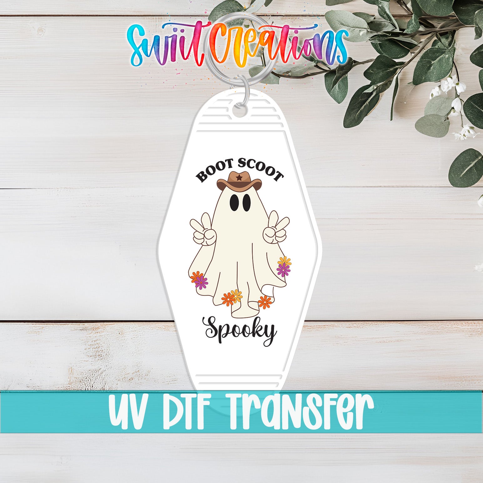 A keychain with a ghost character and the text "Boots Scoot Spooky" printed on it, along with the UV DFT Transfer logo.