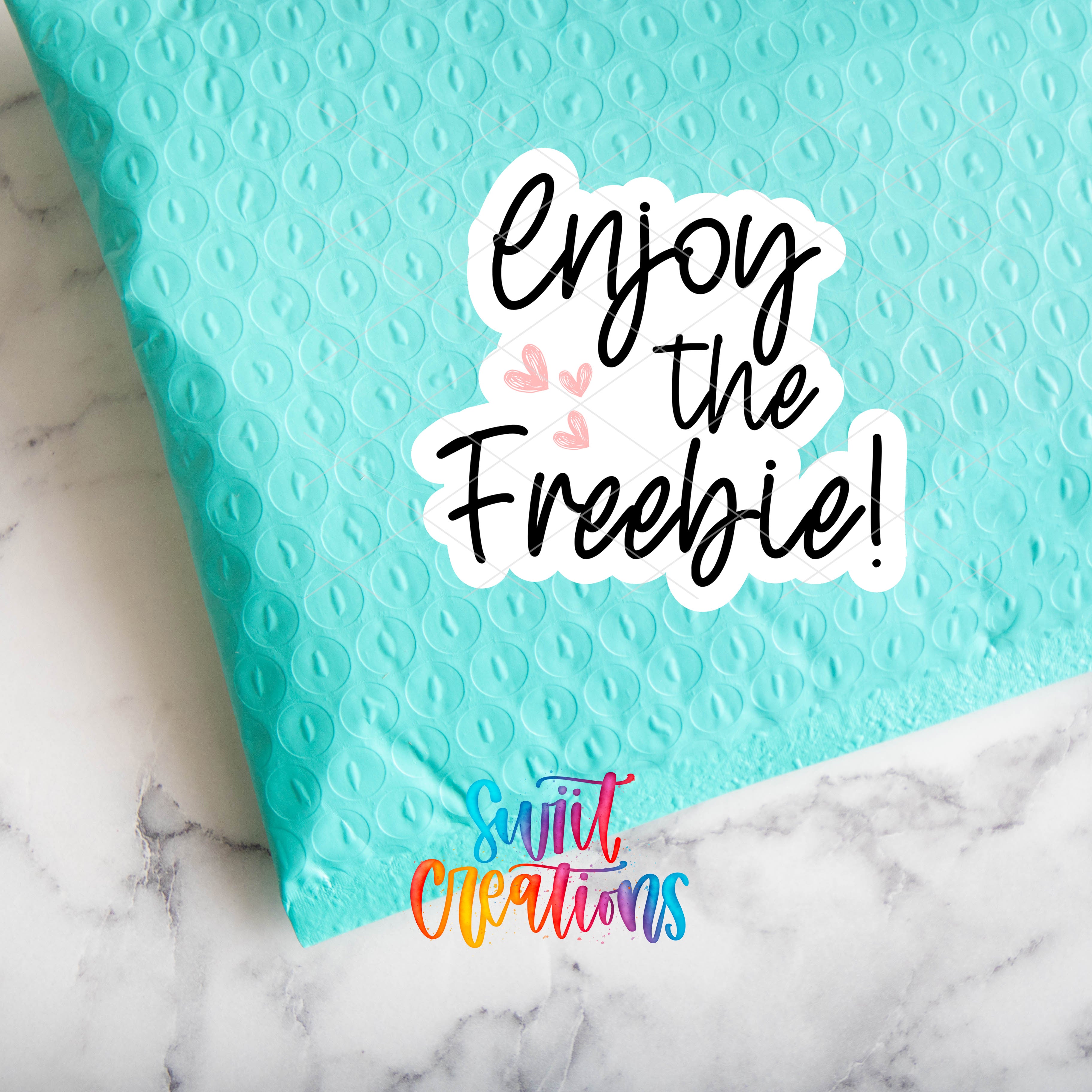 a blue pillow with the words enjoy the freebie on it