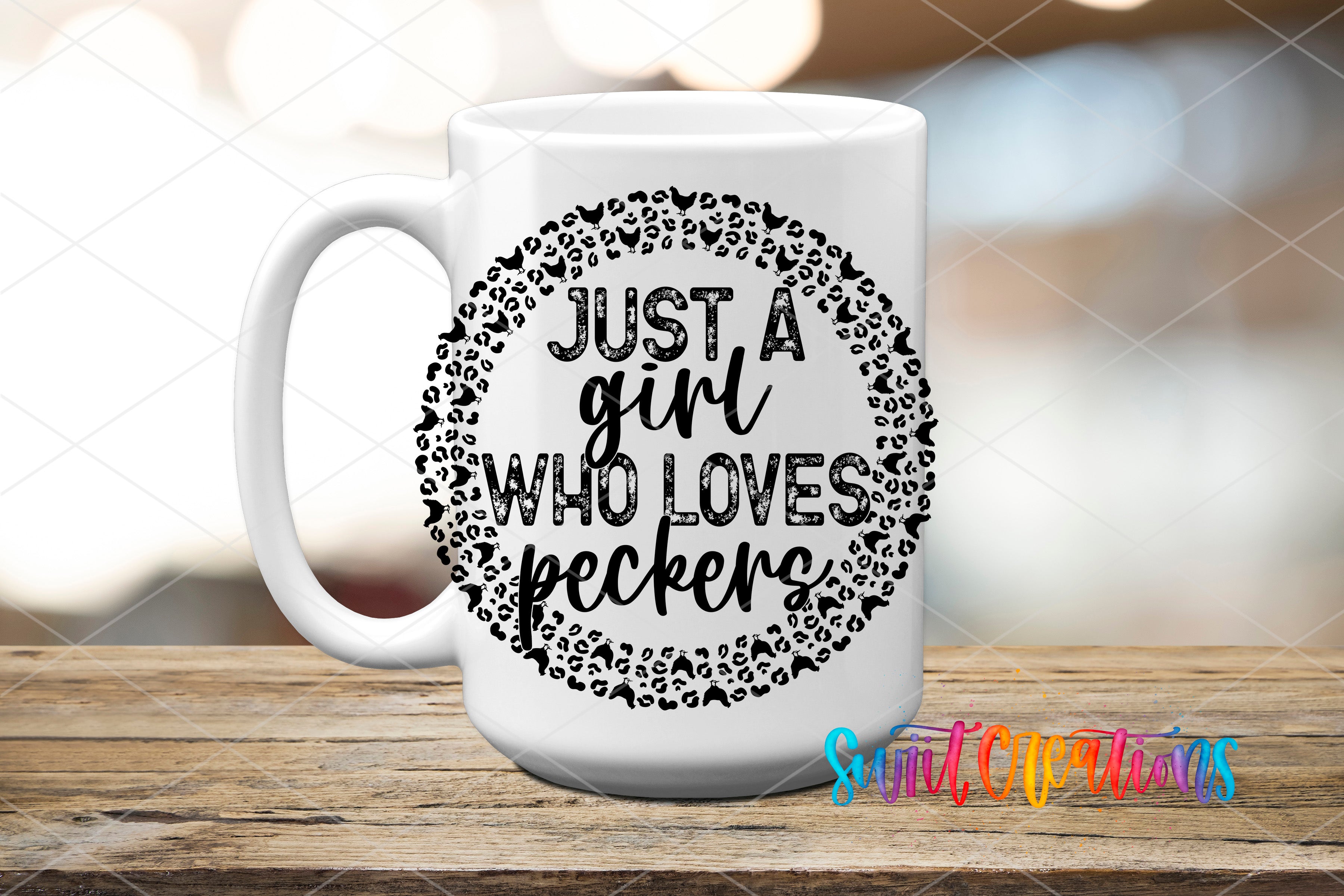 A white ceramic mug with a black and white design featuring the text "Just a girl who loves peckers" surrounded by a circular pattern of leopard print shapes.
