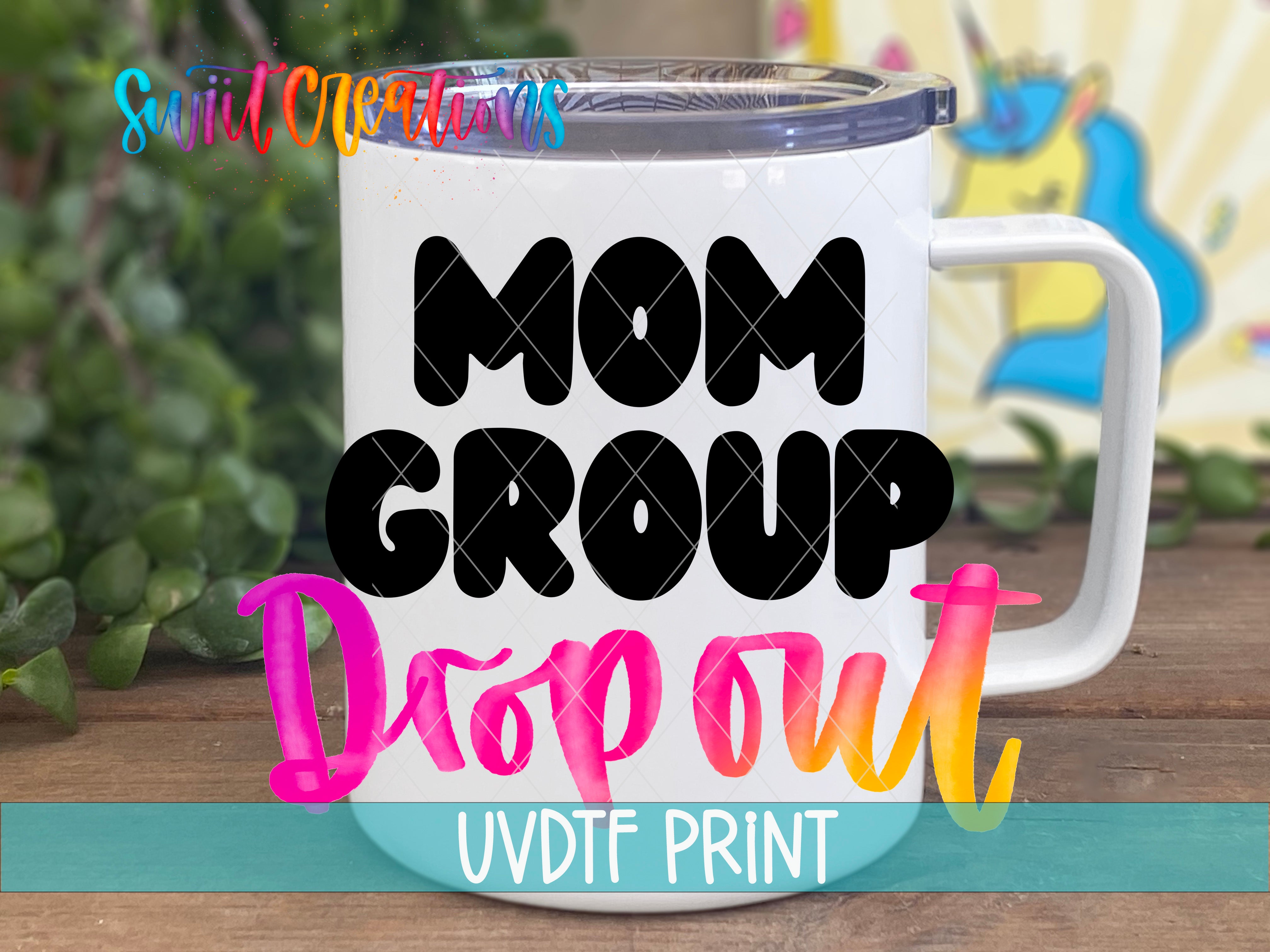 A white mug with the text "MOM GROUP DROP OUT" printed on it, along with a unicorn graphic in the background.