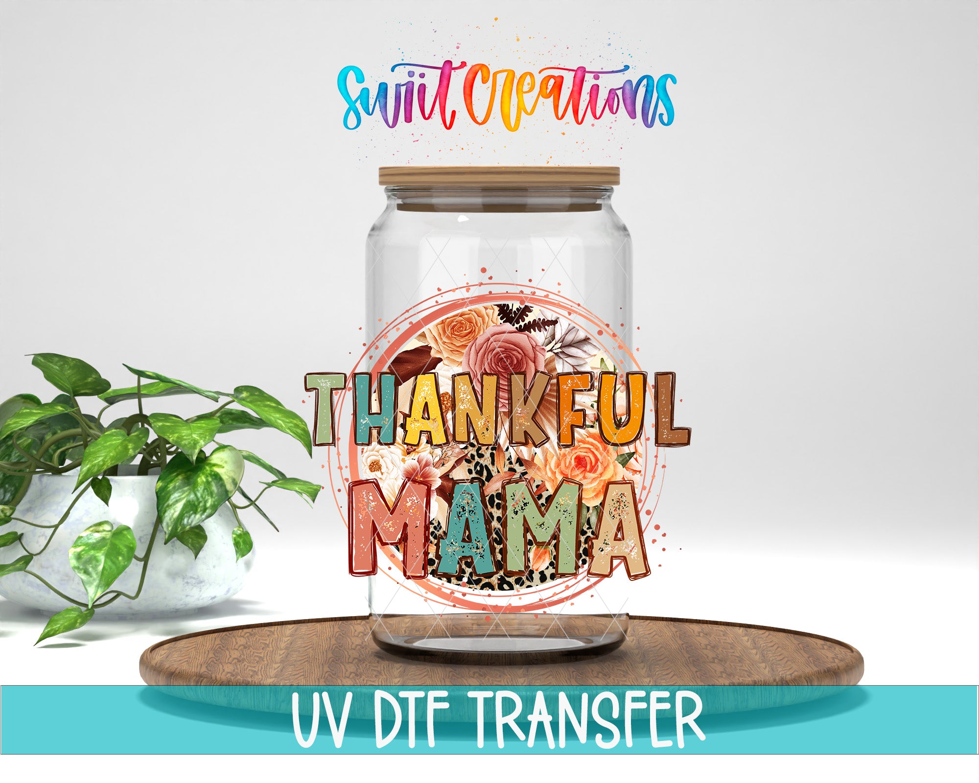 A glass jar with a floral design and the text "THANKFUL MAMA" printed on it, placed on a wooden surface.