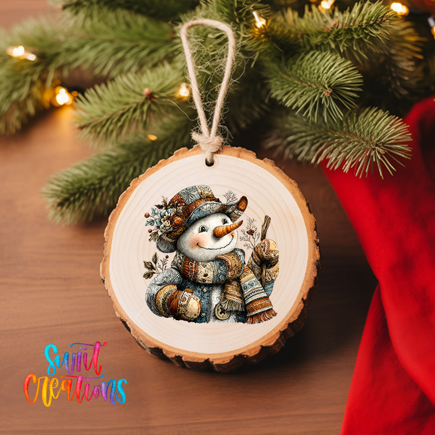 A wooden ornament featuring a smiling snowman is hanging on a Christmas tree, surrounded by pine branches and twinkling lights.