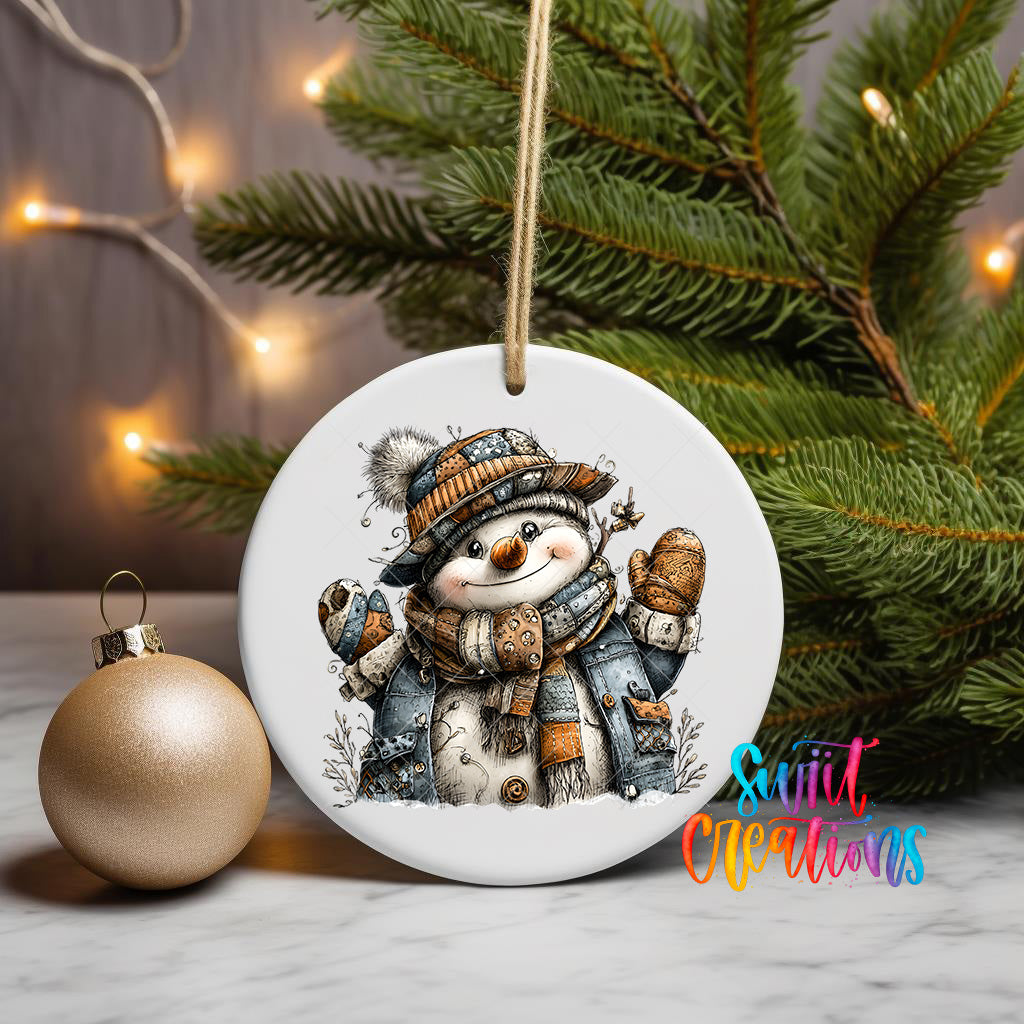 A white ceramic ornament featuring a snowman is displayed on a table, with a Christmas tree and twinkling lights in the background.