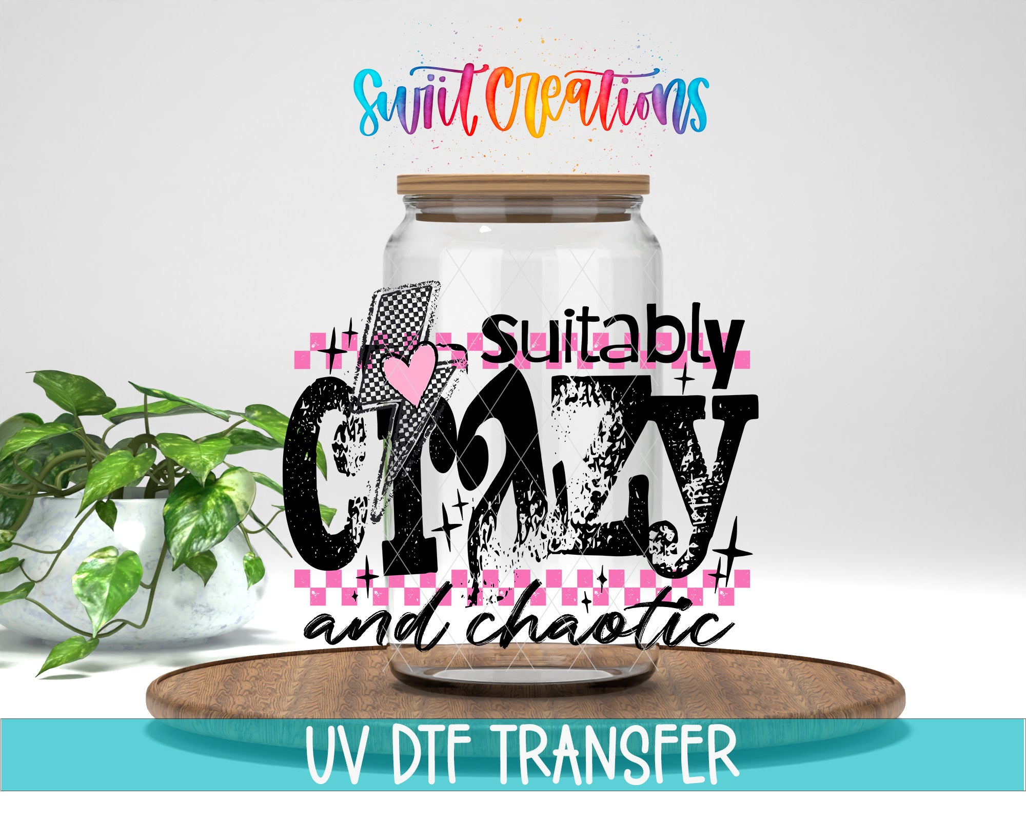 a glass jar with a wooden lid, surrounded by a potted plant and a wooden tray. The text on the jar reads "suitable crazy and chaotic", and the text above the jar says "Swit Creations". The image also includes the text "UV Dtf Transfer".