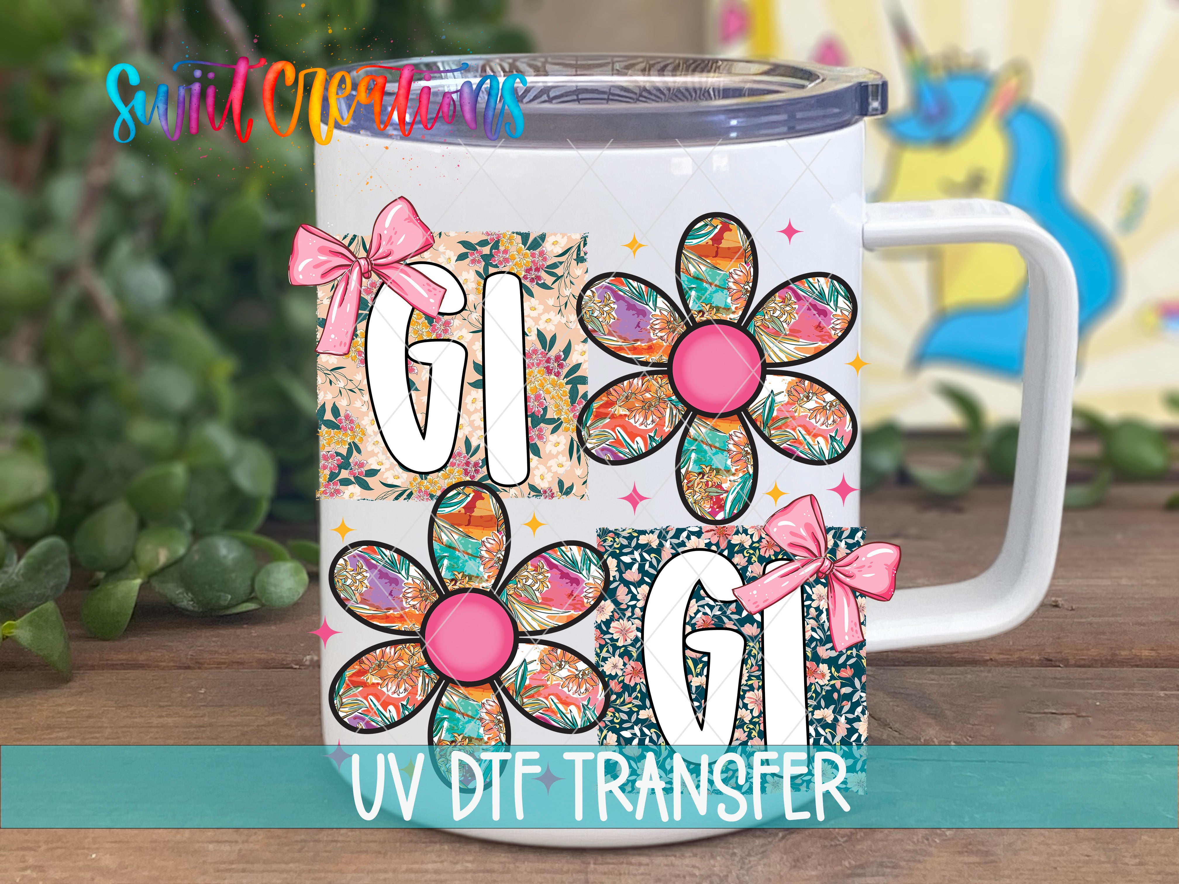 A white mug with colorful floral designs and the text "UV DFT Transfer" printed on it.