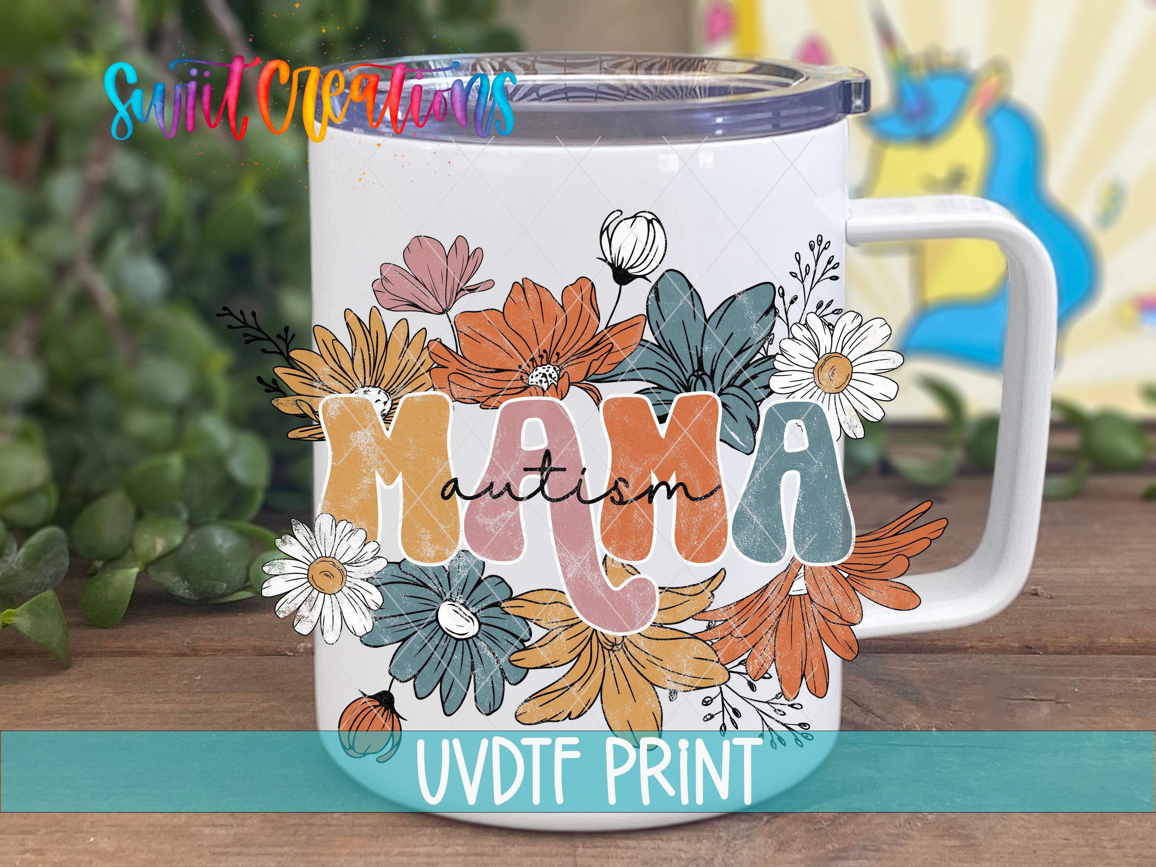 A white ceramic mug with a colorful floral design and the word "Mama" written on it.