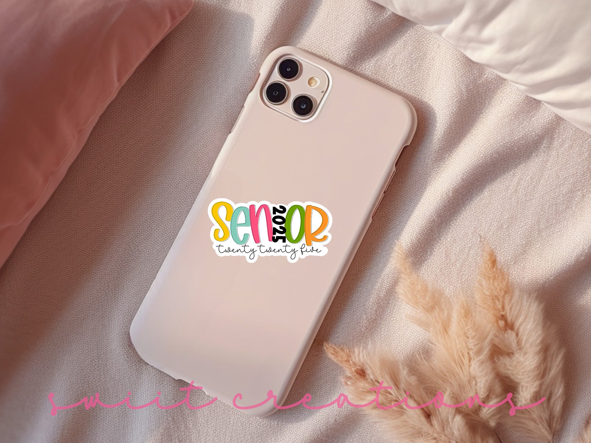 a phone case sitting on top of a bed
