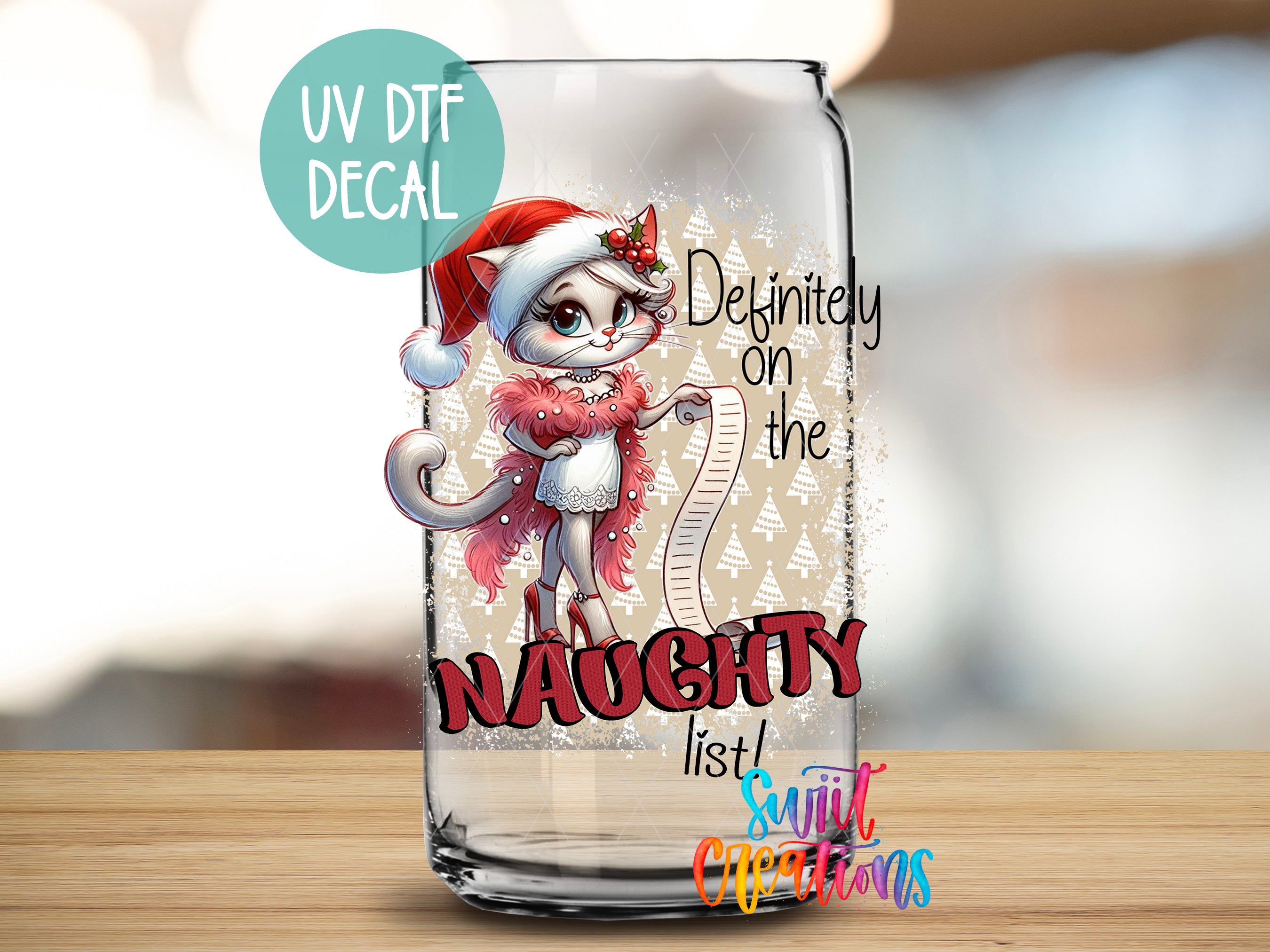 a glass with a picture of a cat wearing a santa hat