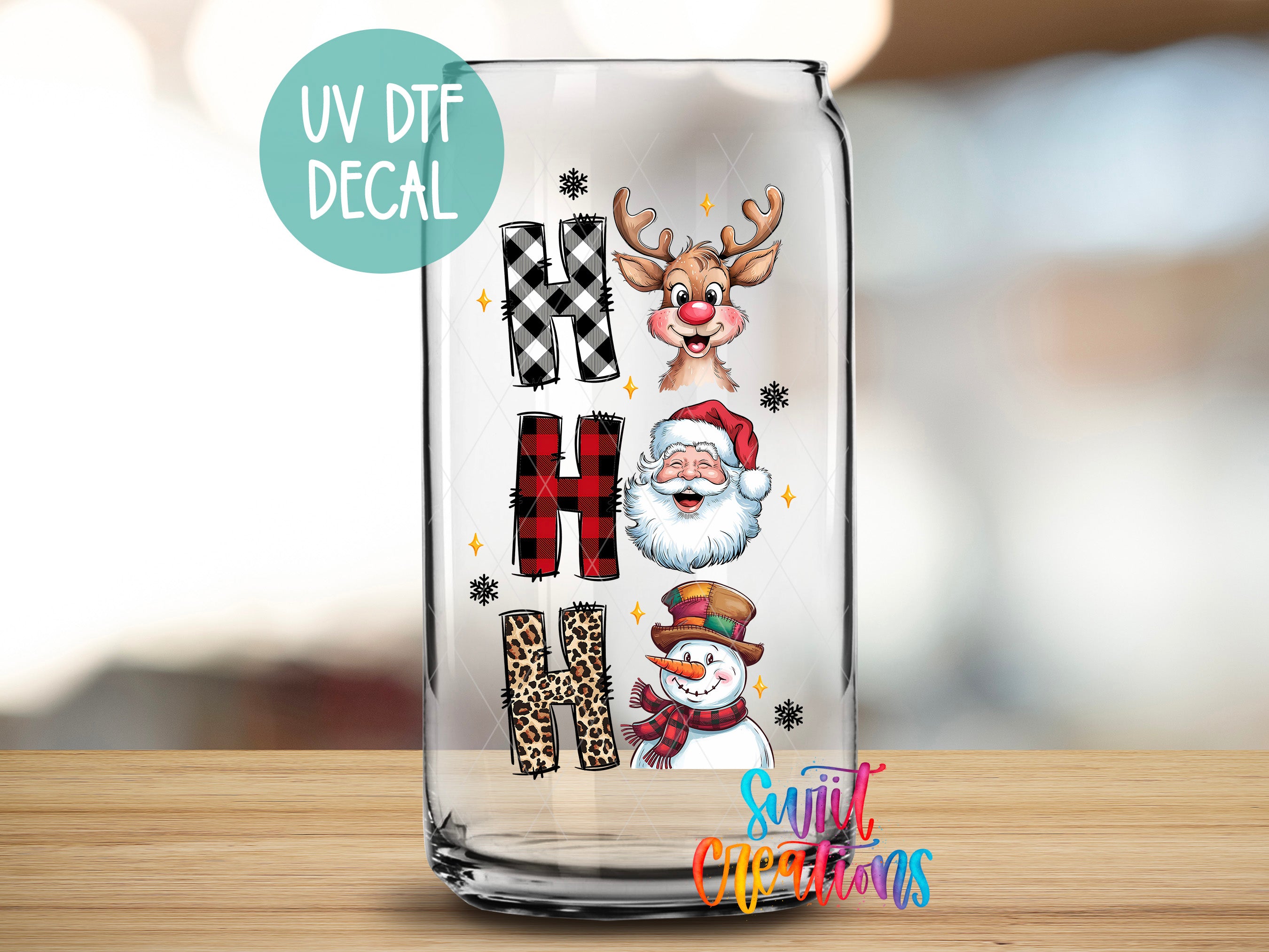 a glass with a picture of santa claus and other christmas related items