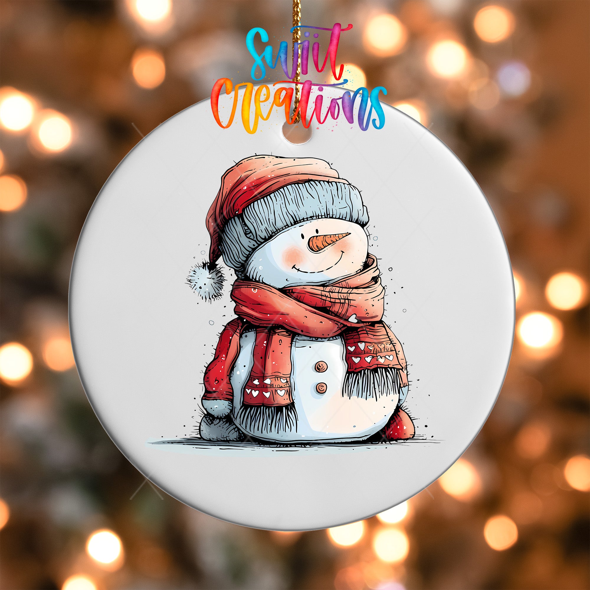 A snowman ornament with a red scarf and hat, sitting on a snowy surface, is hanging against a background of colorful lights.