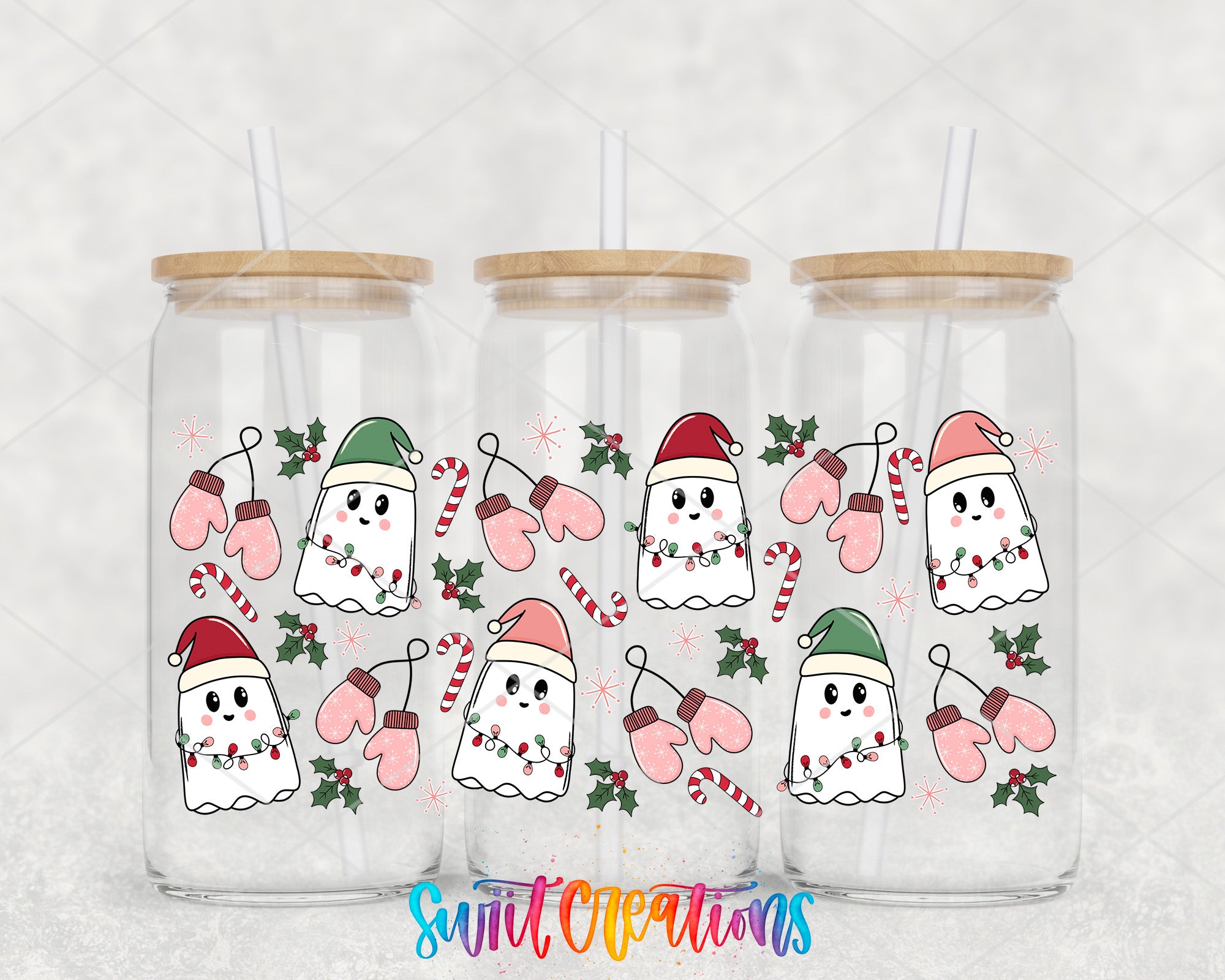 A collection of three glass tumblers with a festive holiday design featuring ghostly figures, Santa hats, and Christmas-themed decorations such as candy canes and holly leaves.