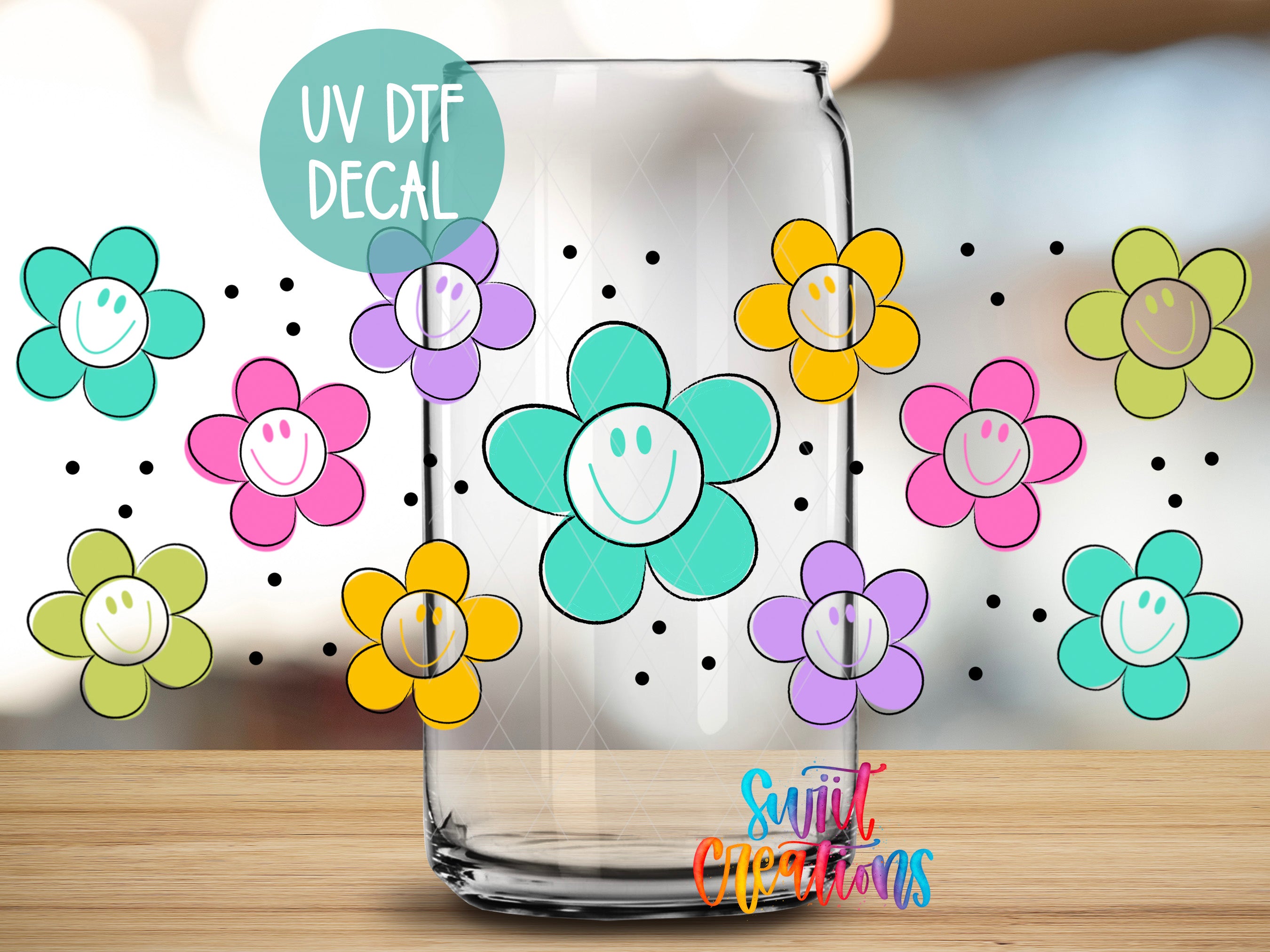 a clear glass jar with a UV decal of colorful flowers on it, placed on a wooden surface.