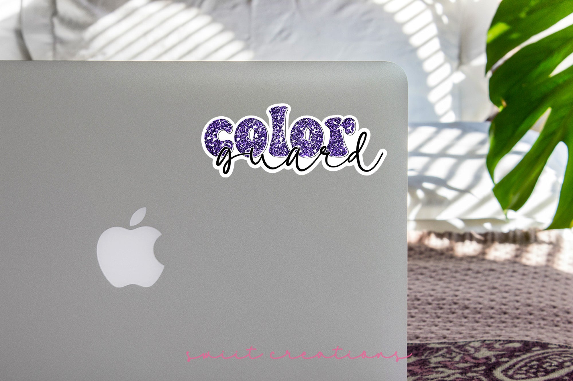 a laptop computer sitting on top of a table