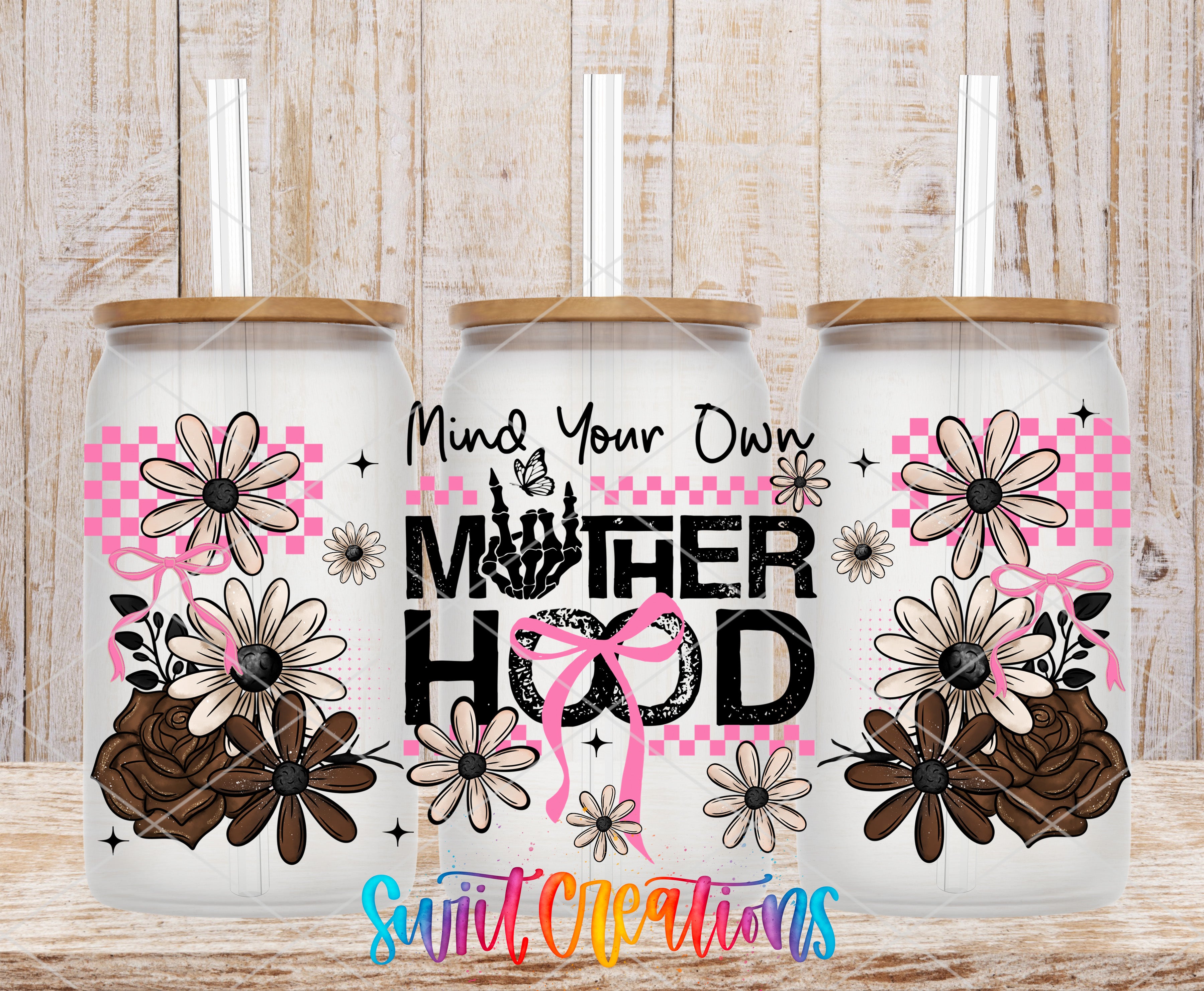 three glass tumblers with floral designs and the text "Motherhood" printed on them.