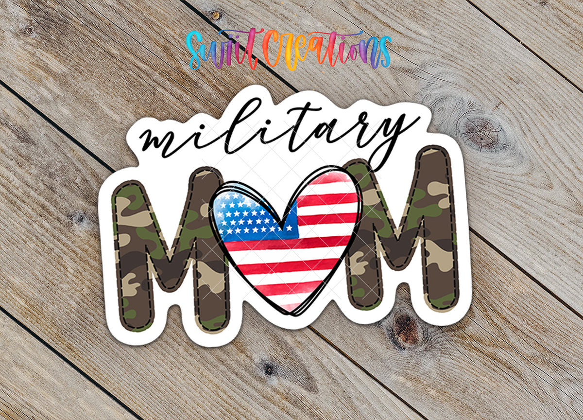 A sticker with the word "MOM" in camouflage letters, with a heart-shaped American flag inside the letters.