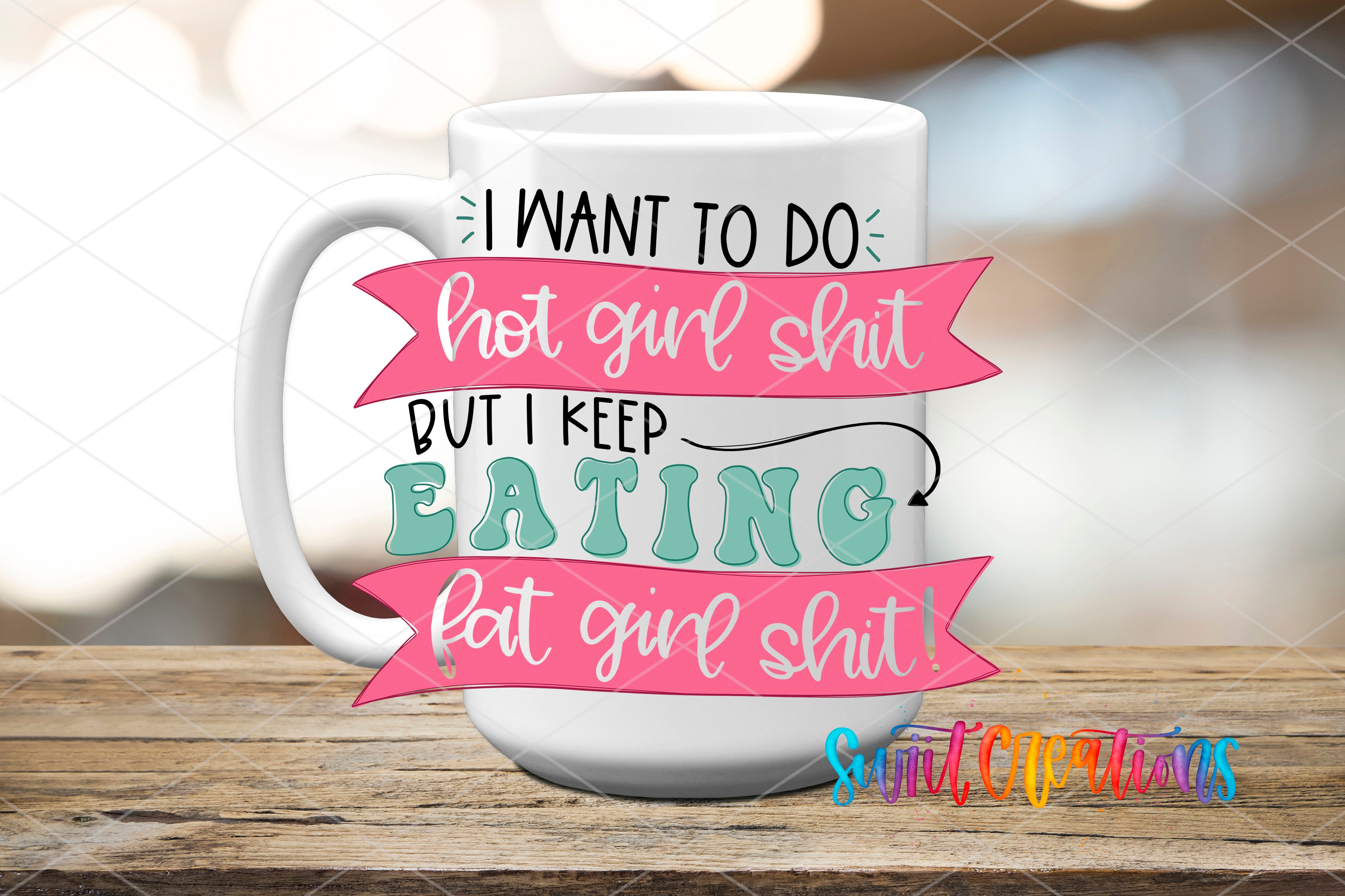 A white mug with a colorful and playful design featuring text that reads "I WANT TO DO hot girl shit but I KEEP EATING fat girl shit!"