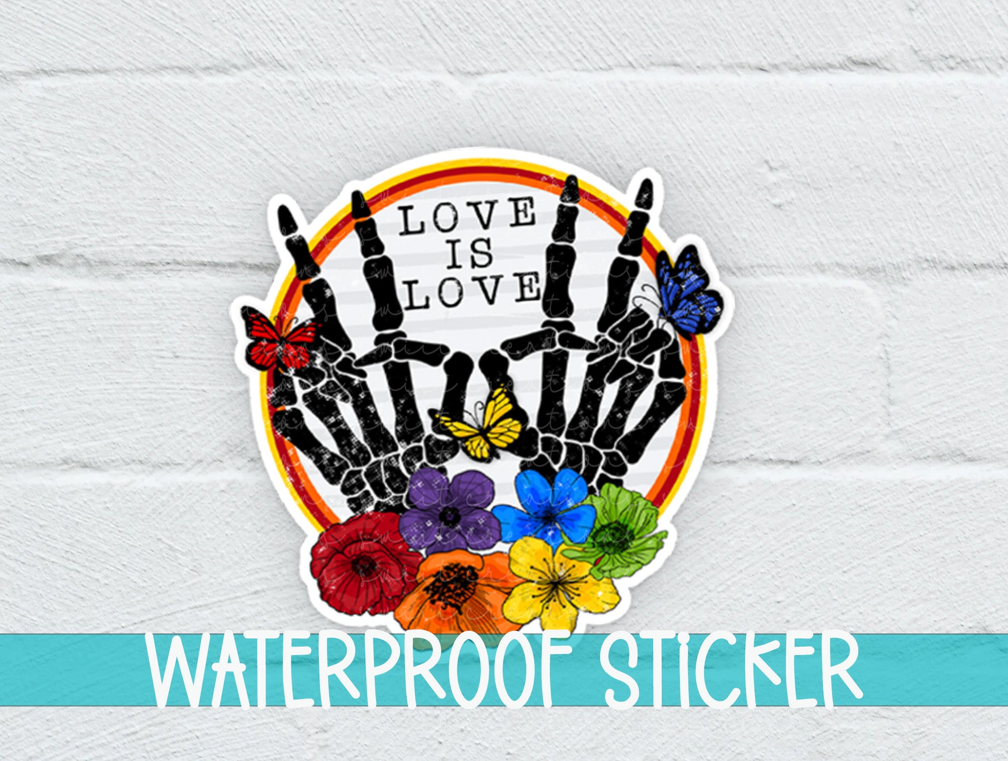 a white brick wall with a sticker of two hands holding flowers