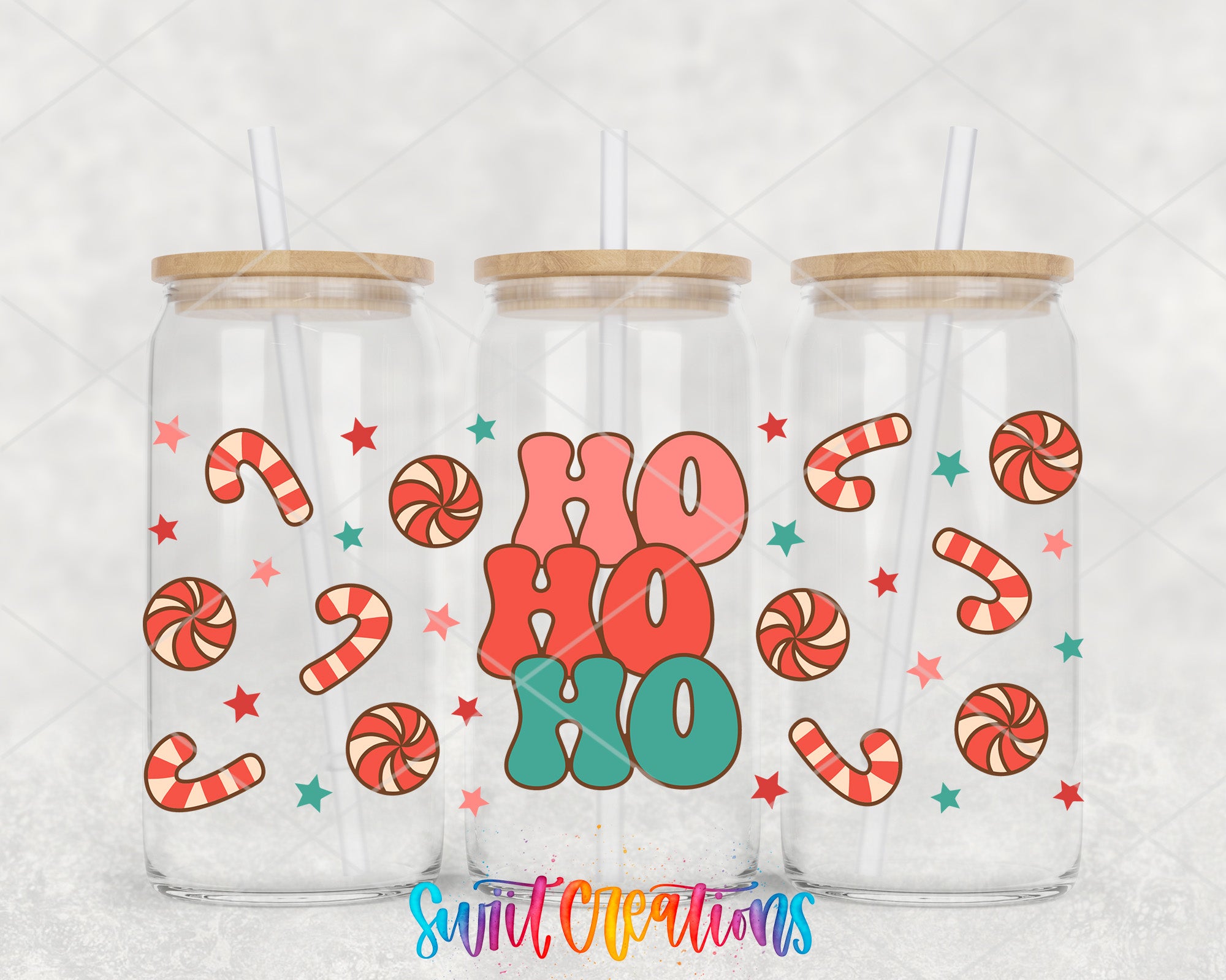 Three glass tumblers with lids, each decorated with candy canes and stars, and the word "HO HO" prominently displayed in the center.