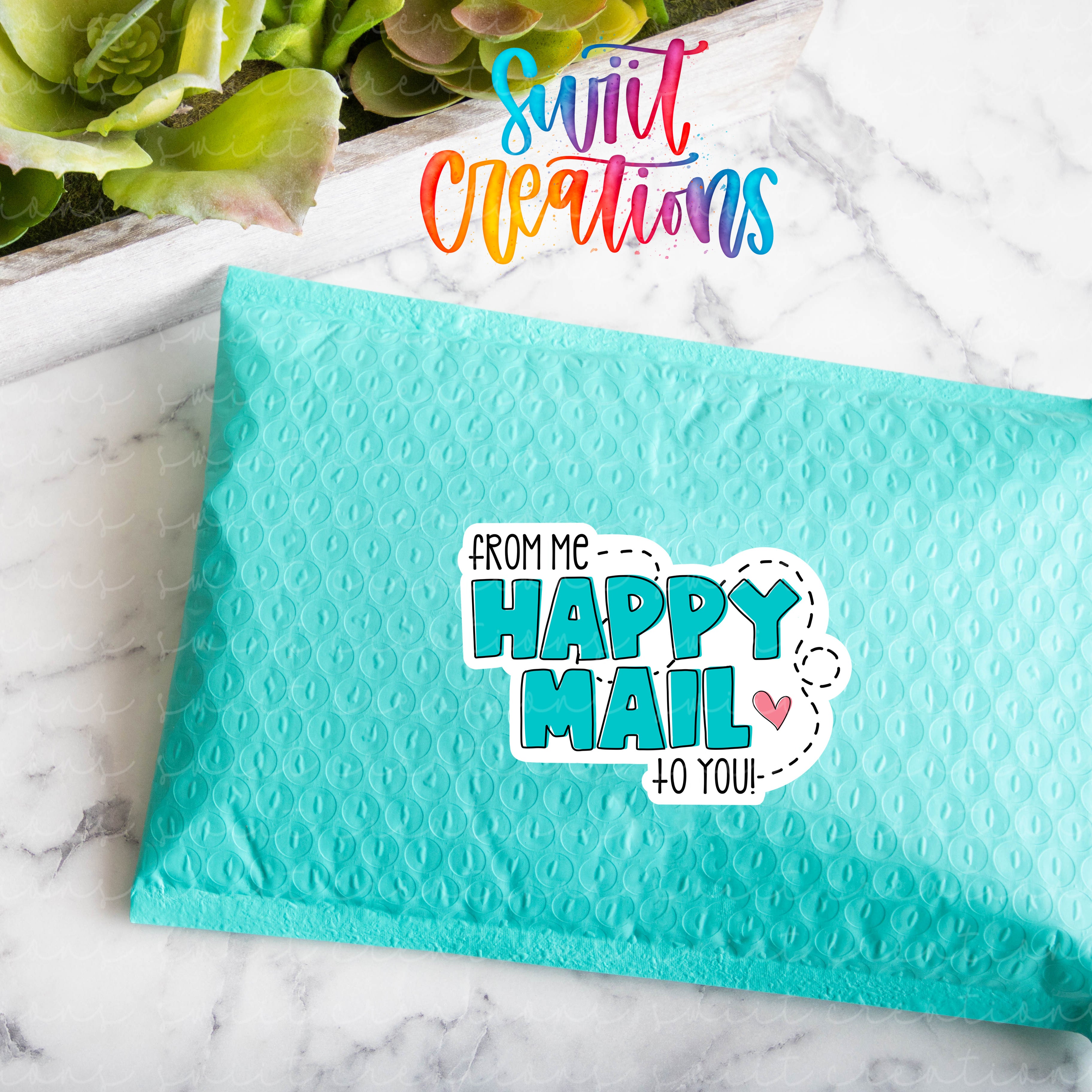 a blue envelope with the words from me happy mail on it