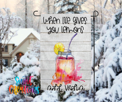 A banner with a lemonade drink and a lemon slice, set against a snowy background with a house and trees in the distance.