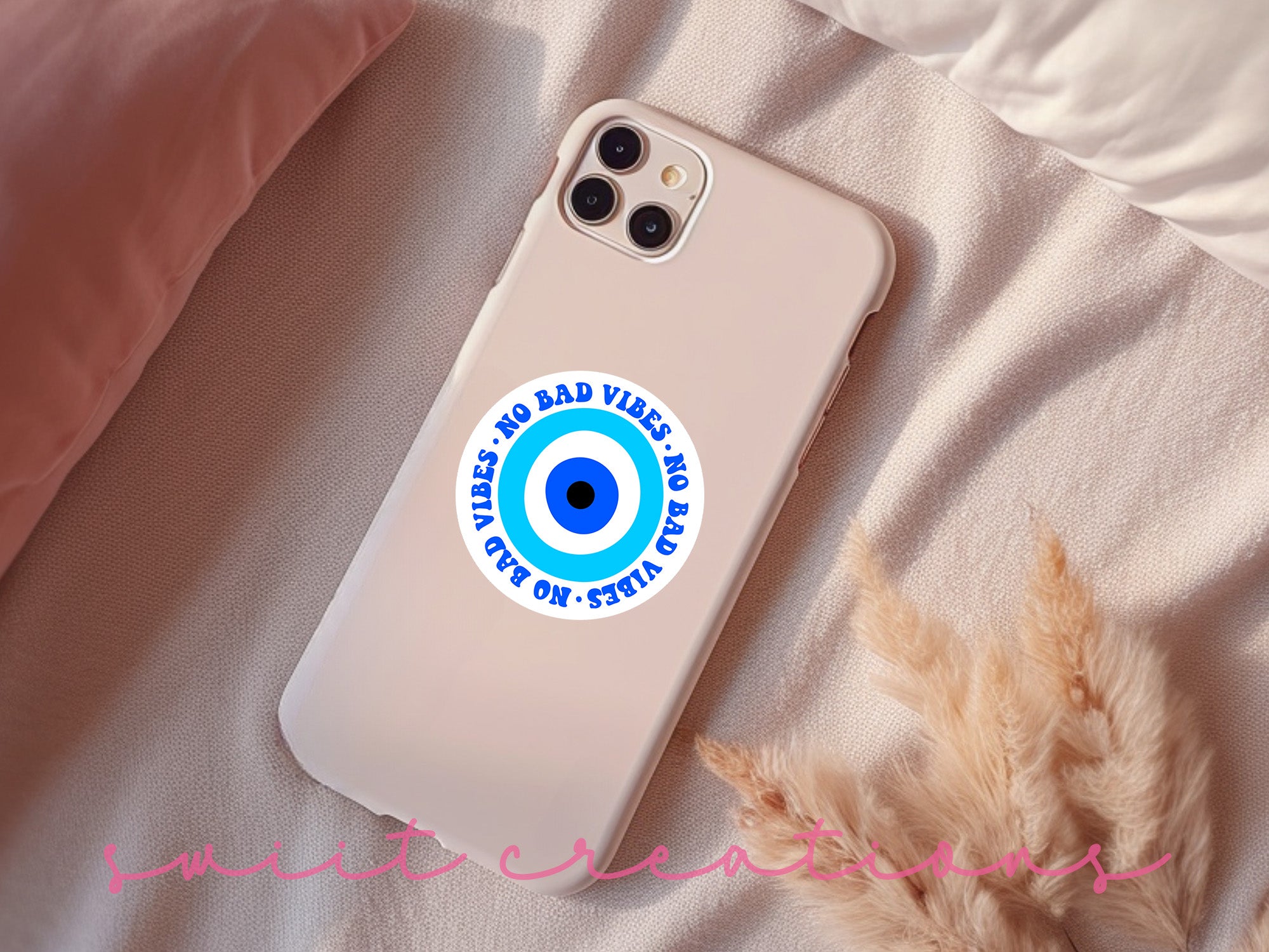 a phone case with an eyeball sticker on it
