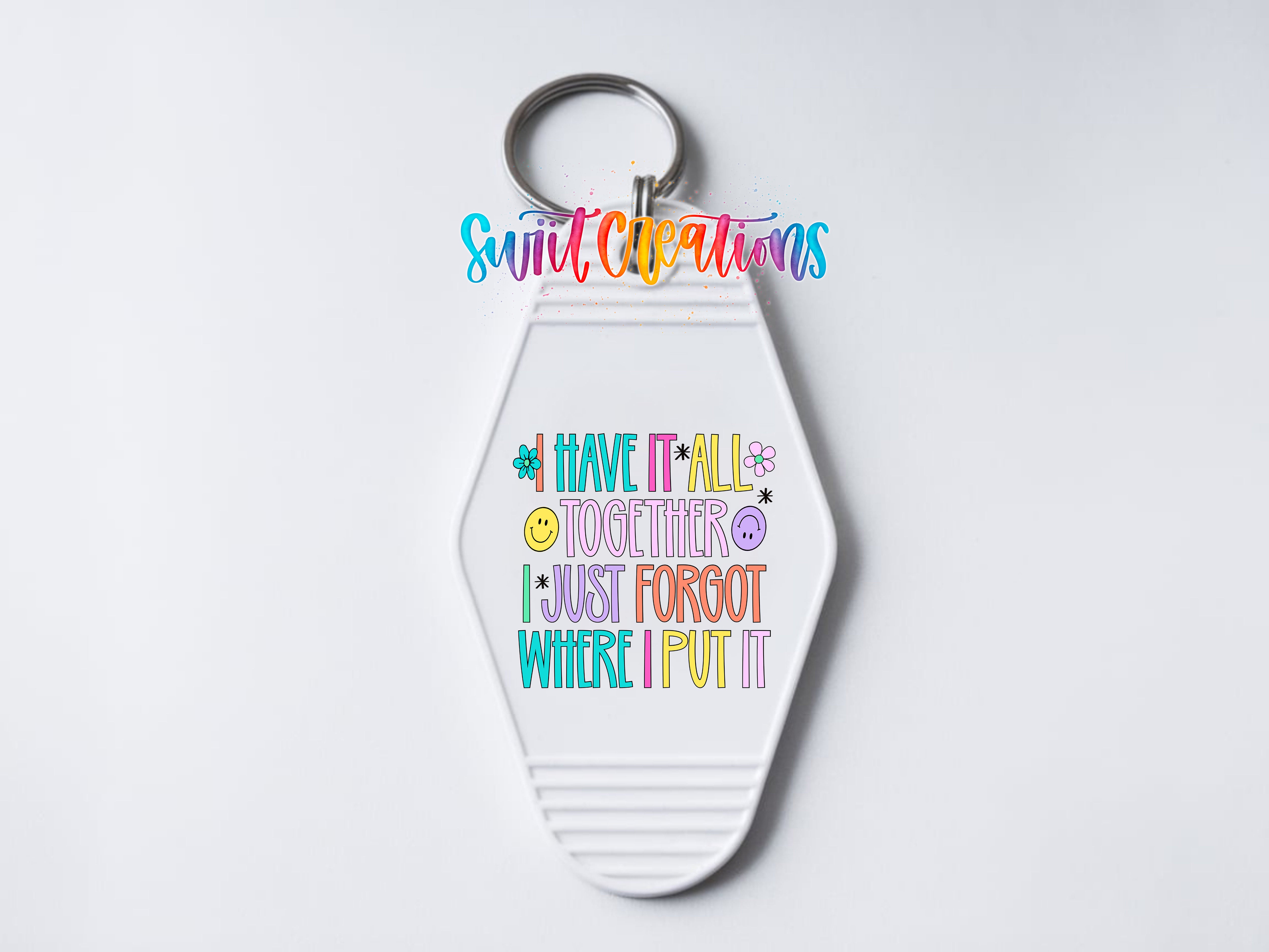 A keychain with a colorful, hand-lettered message that reads "I HAVE IT ALL TOGETHER I JUST FORGET WHERE I PUT IT"