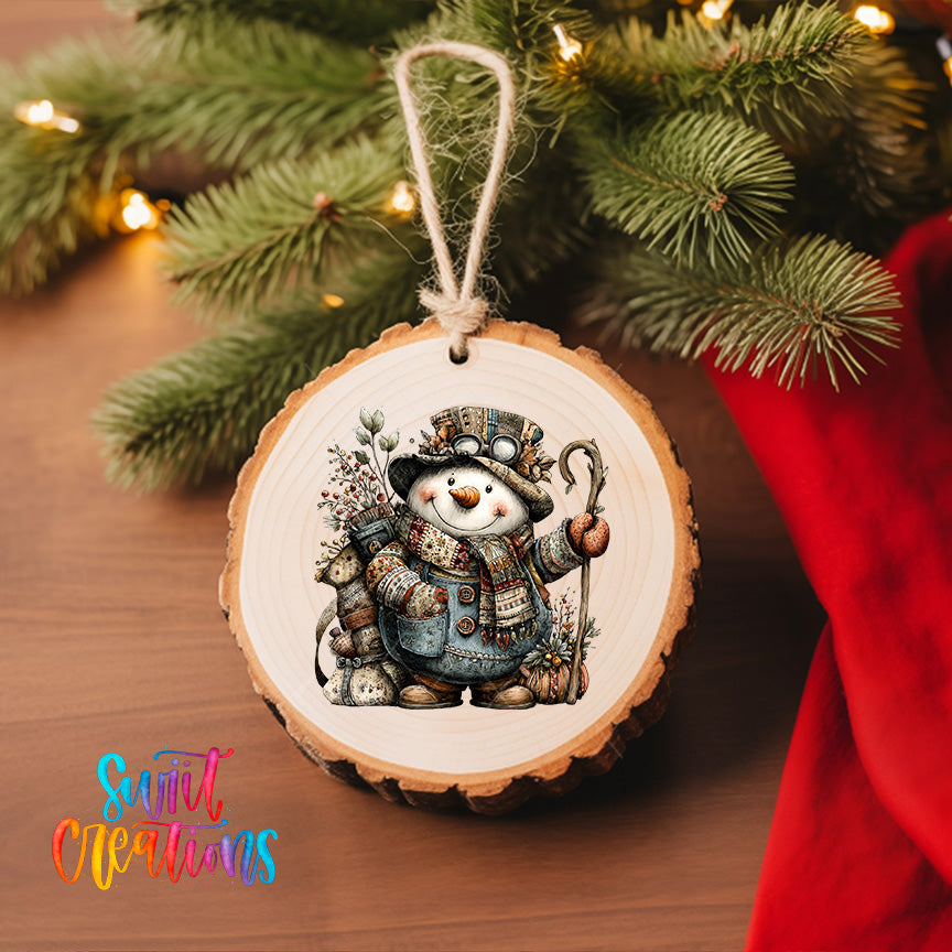 A wooden ornament featuring a snowman with a carrot nose and a staff, hanging on a Christmas tree.