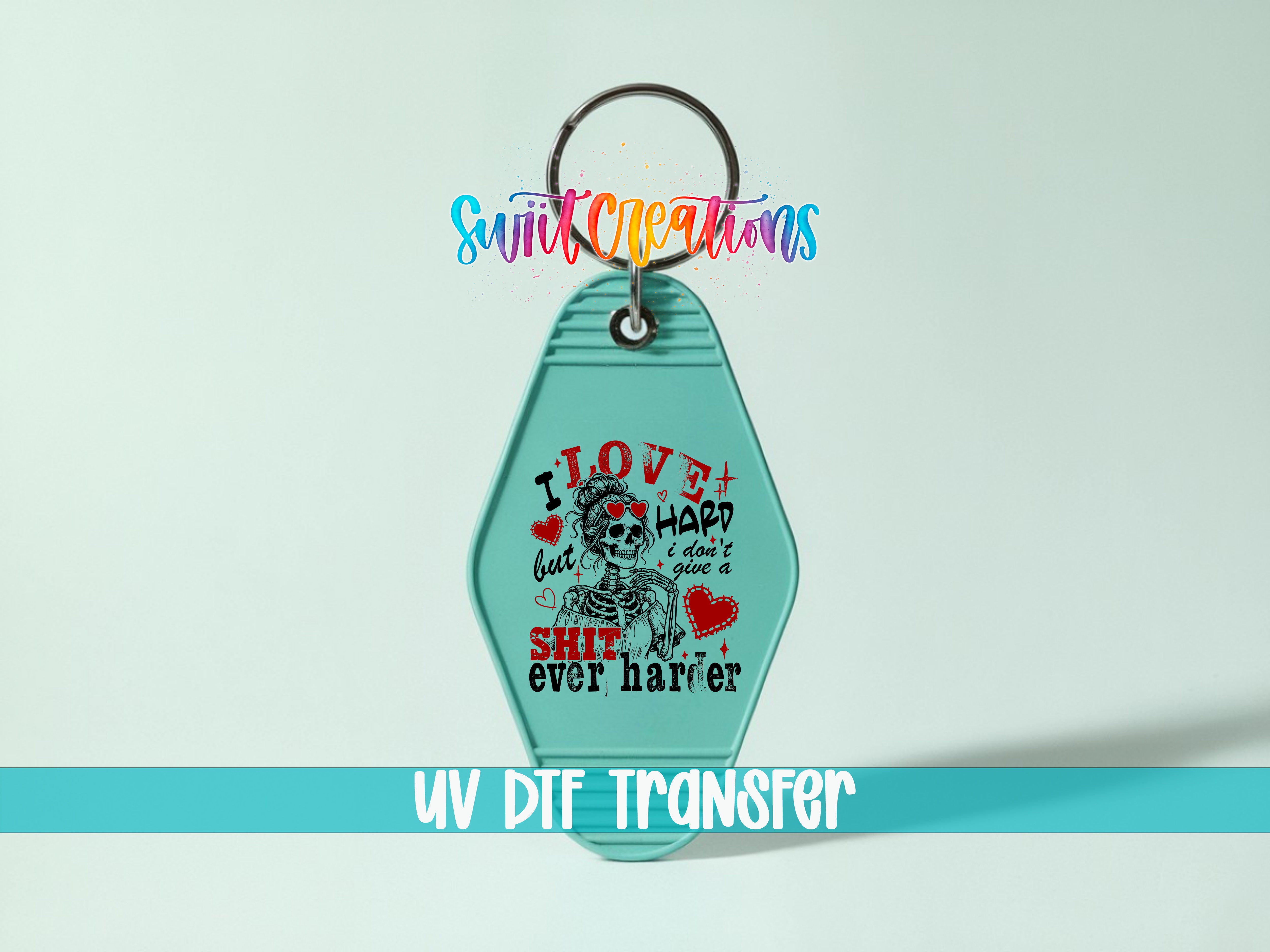 A keychain with a skull design and text printed on it.