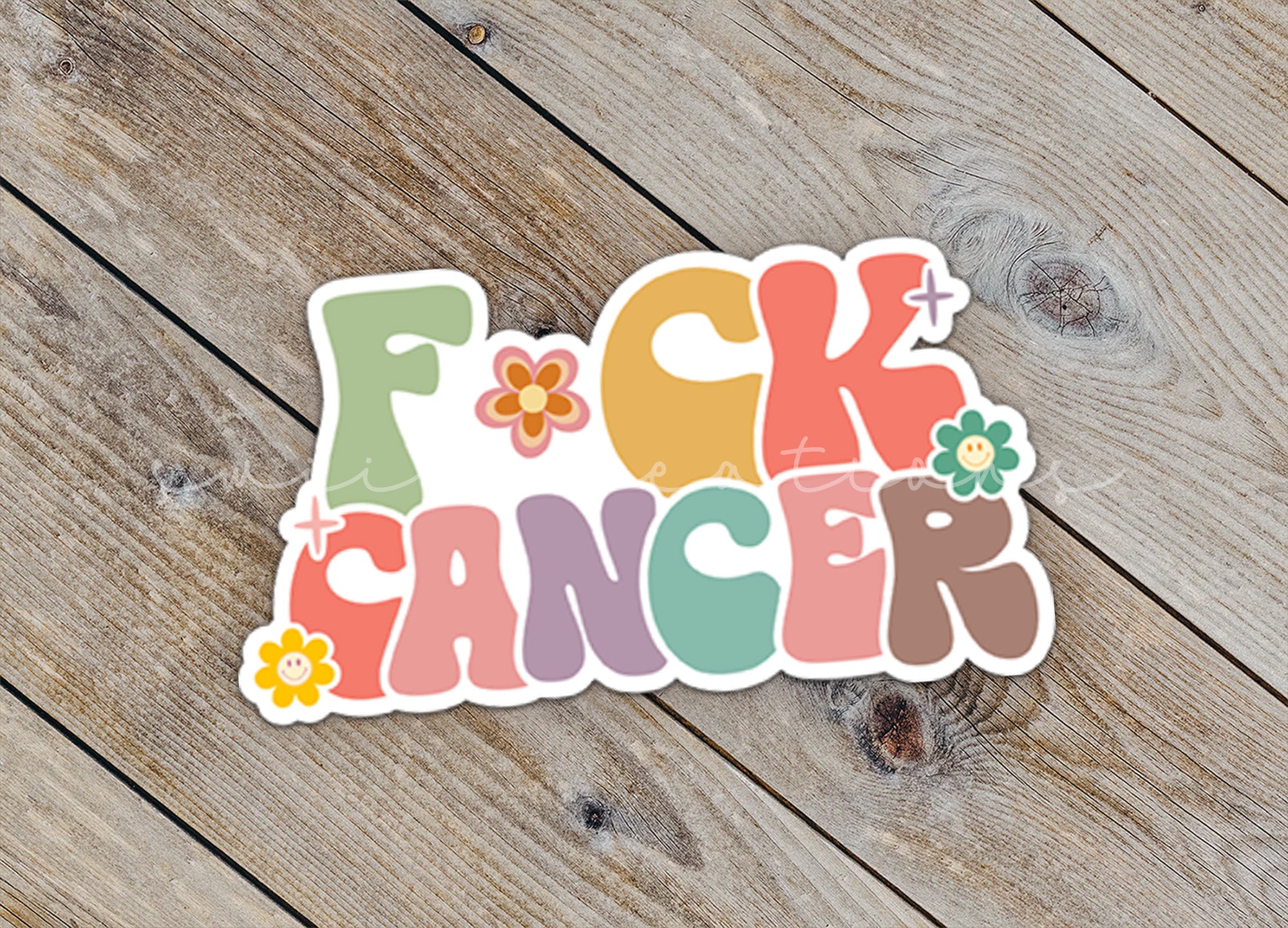 a sticker that says f k cancer on it