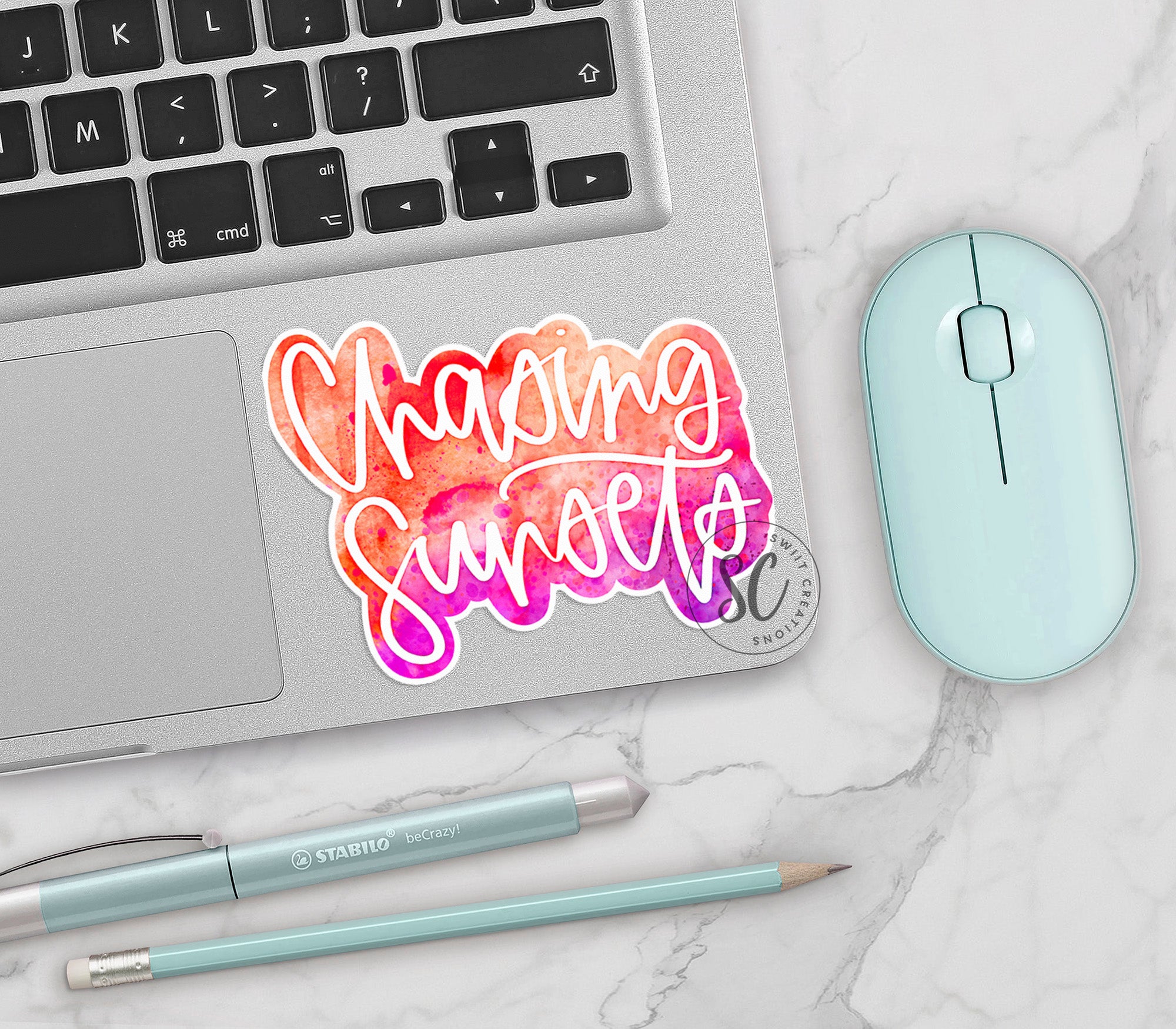 a laptop computer sitting next to a mouse and keyboard