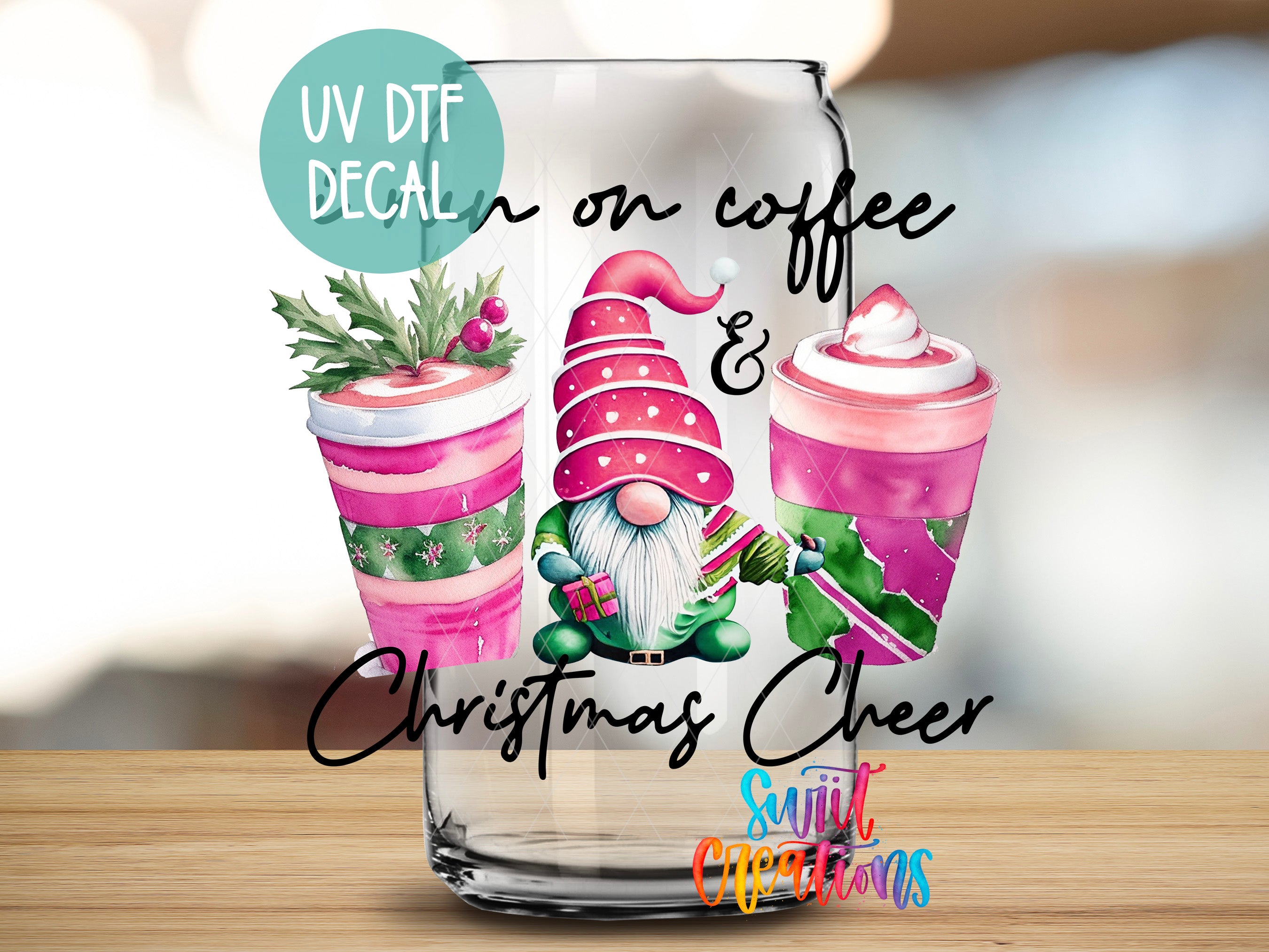 a glass with a picture of a santa clause and a pink coffee cup