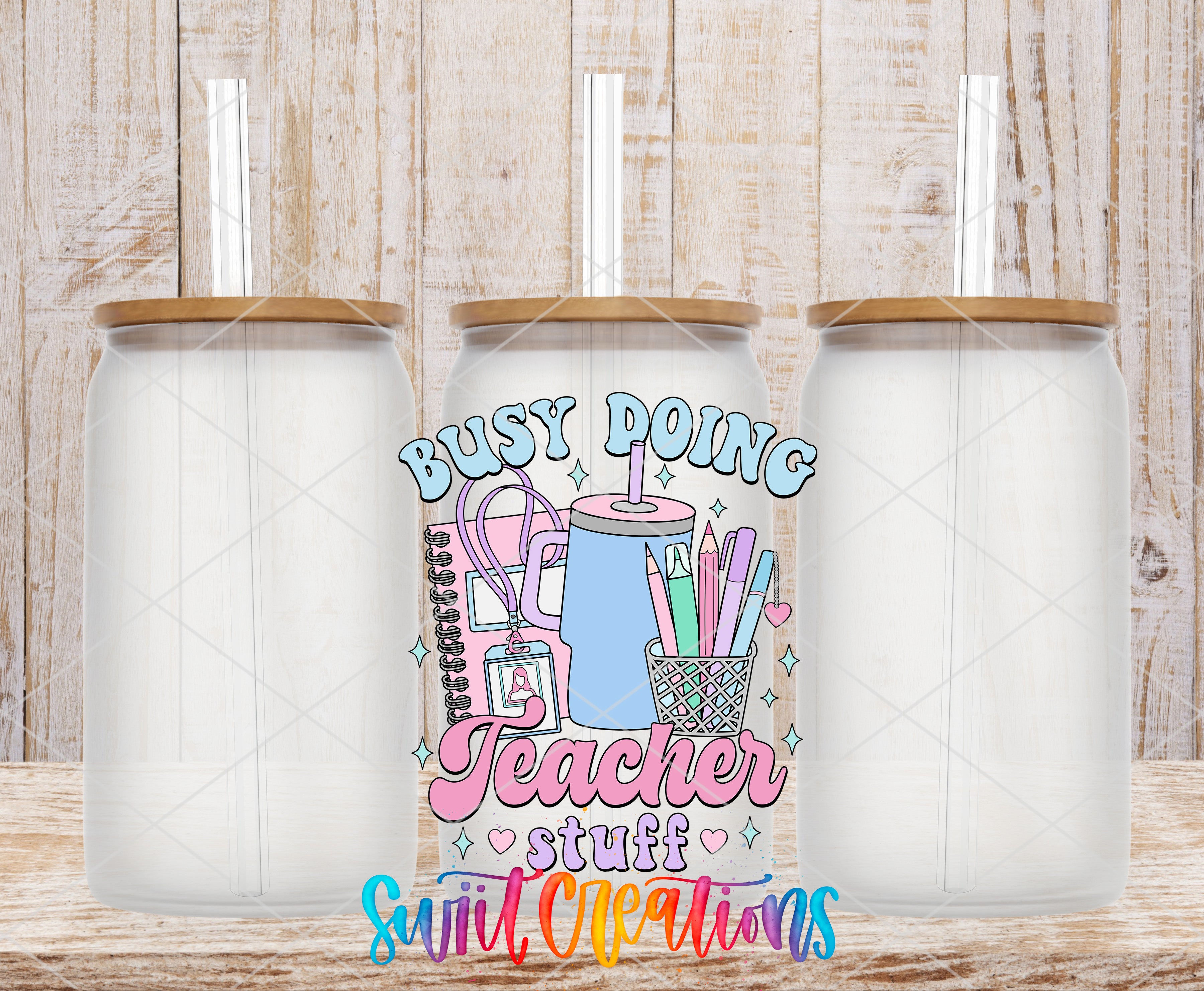 three clear glass jars with lids, arranged in a row against a wooden background. The jars appear to be empty, and there is a colorful graphic design in the center that includes various school supplies and the text "Busy Doing Teacher Stuff".