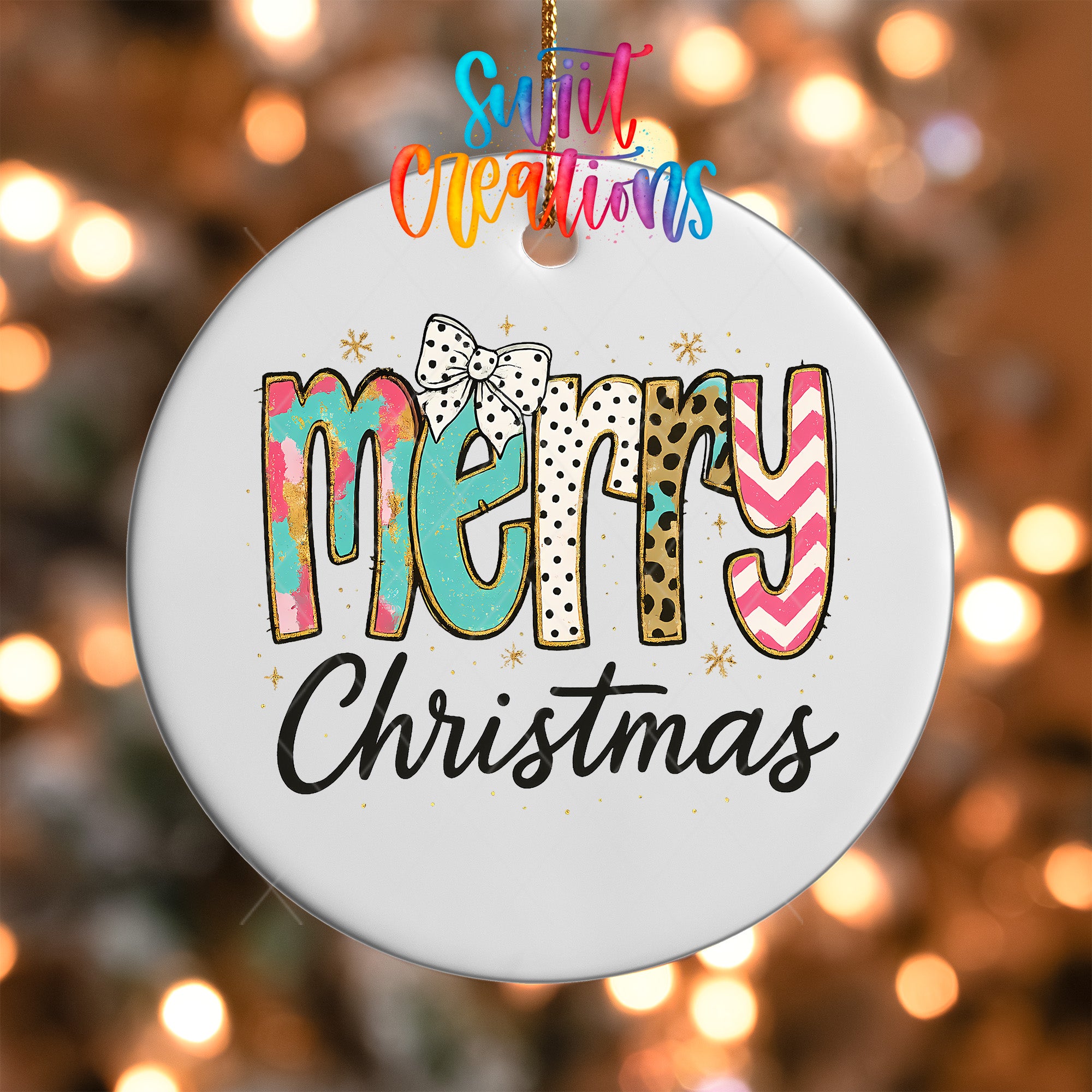 A white ornament with the text "MERRY CHRISTMAS" written on it, surrounded by colorful and whimsical designs.