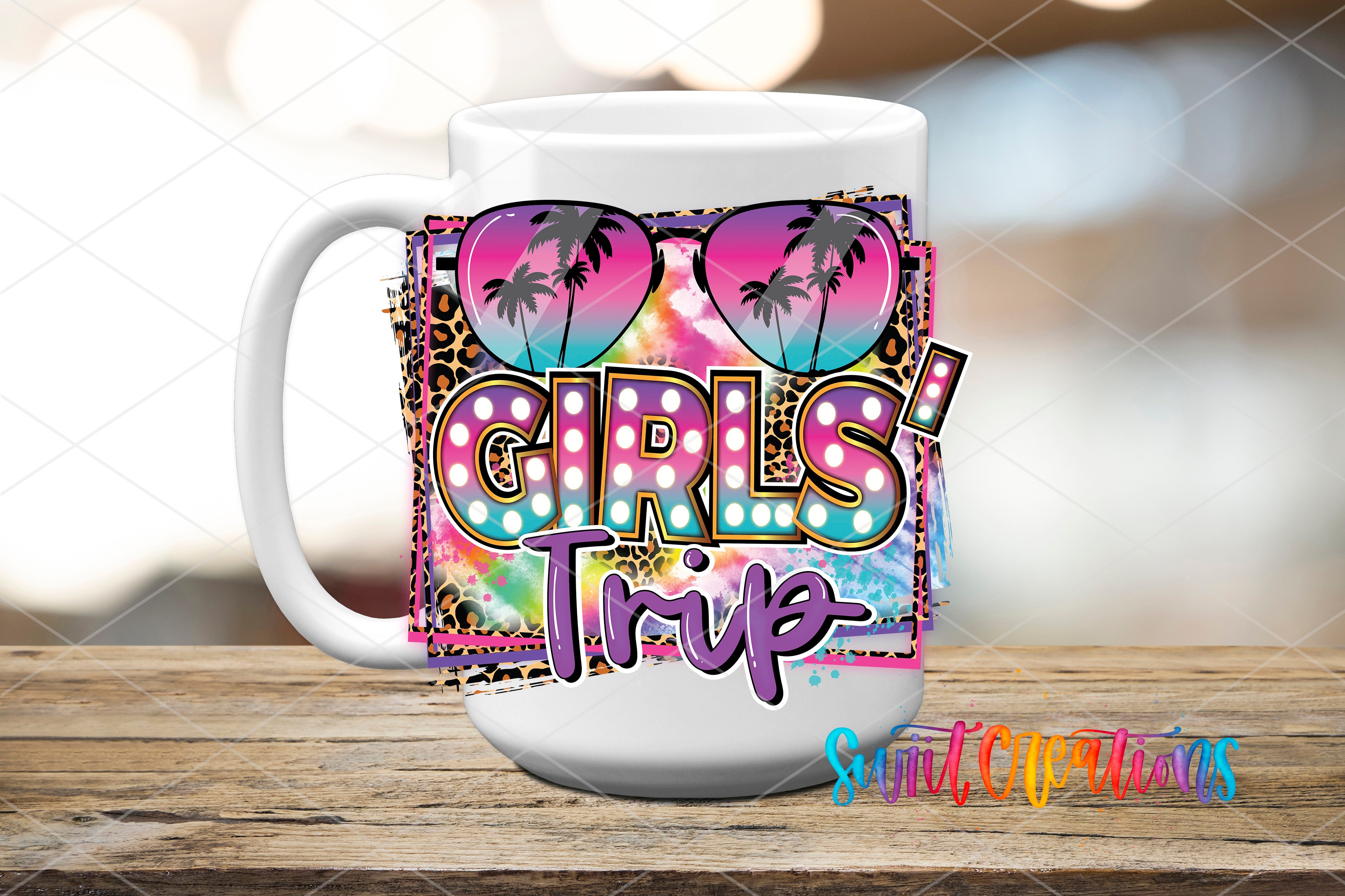 A white mug with a colorful, abstract design featuring sunglasses, palm trees, and the text "GIRLS TRIP" printed on it.