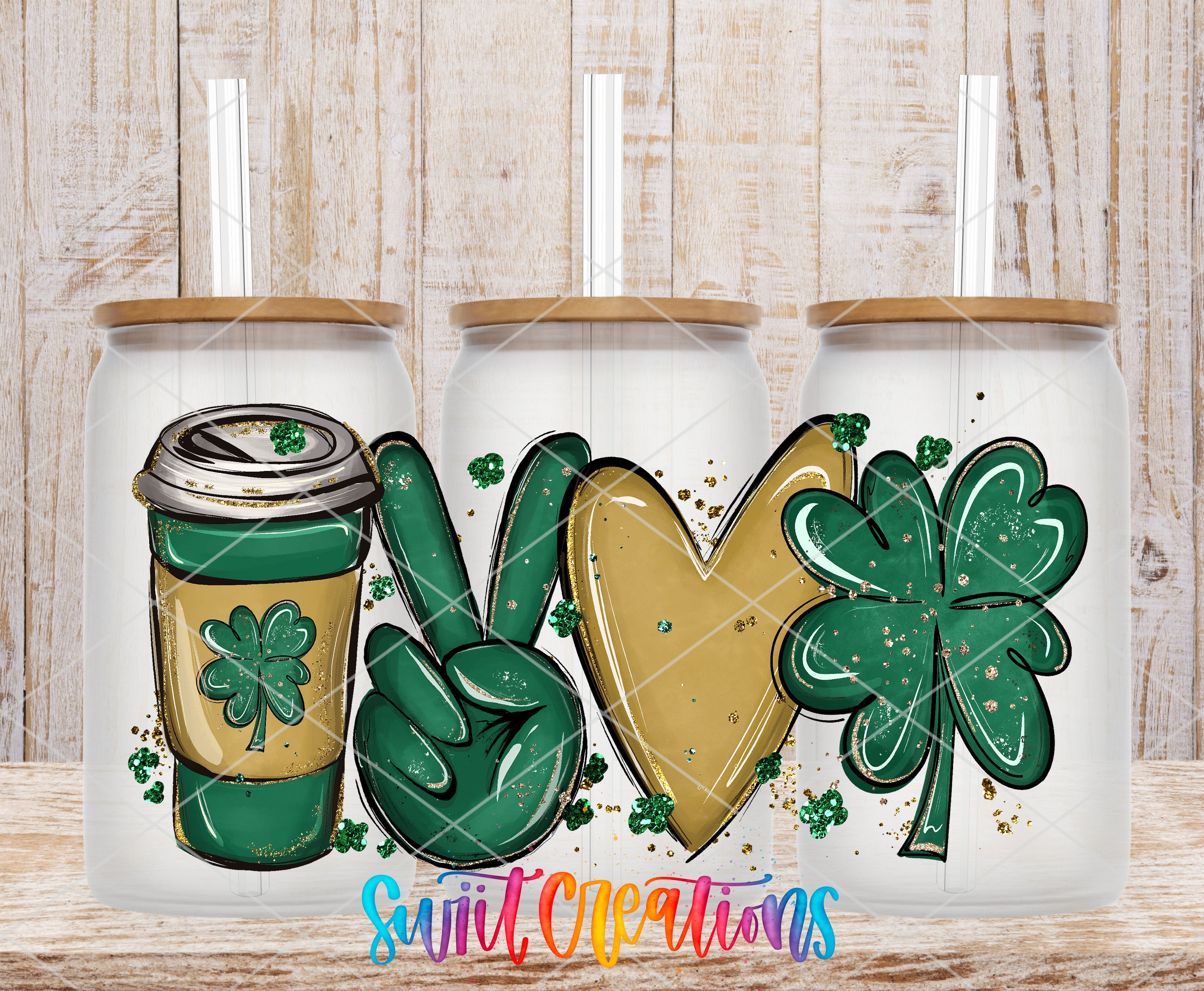 three glass tumblers with various designs and symbols on them, including a coffee cup, a peace sign, a heart, and a cloverleaf.