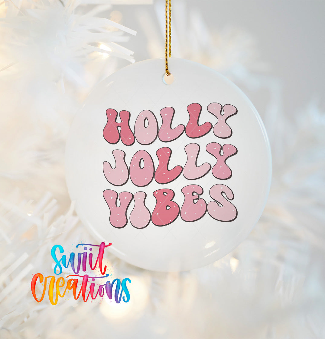 A white ornament with the text "Holly Vibes" in pink and purple letters.
