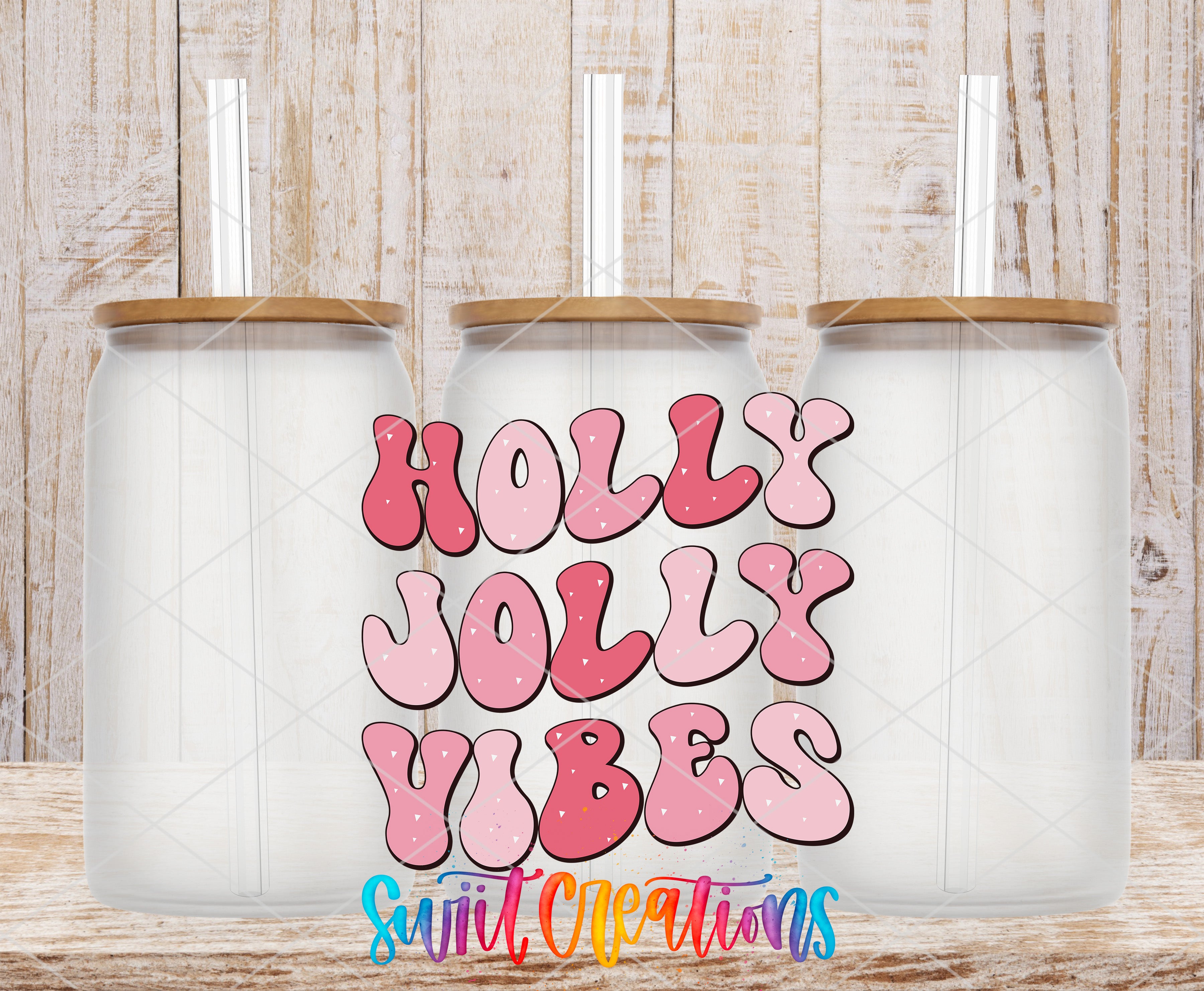 three clear glass jars with lids, arranged in a row against a wooden background. The jars have straws attached to their lids. The text "Holly Jolly Vibes" is written in a playful, colorful font in the center of the image.